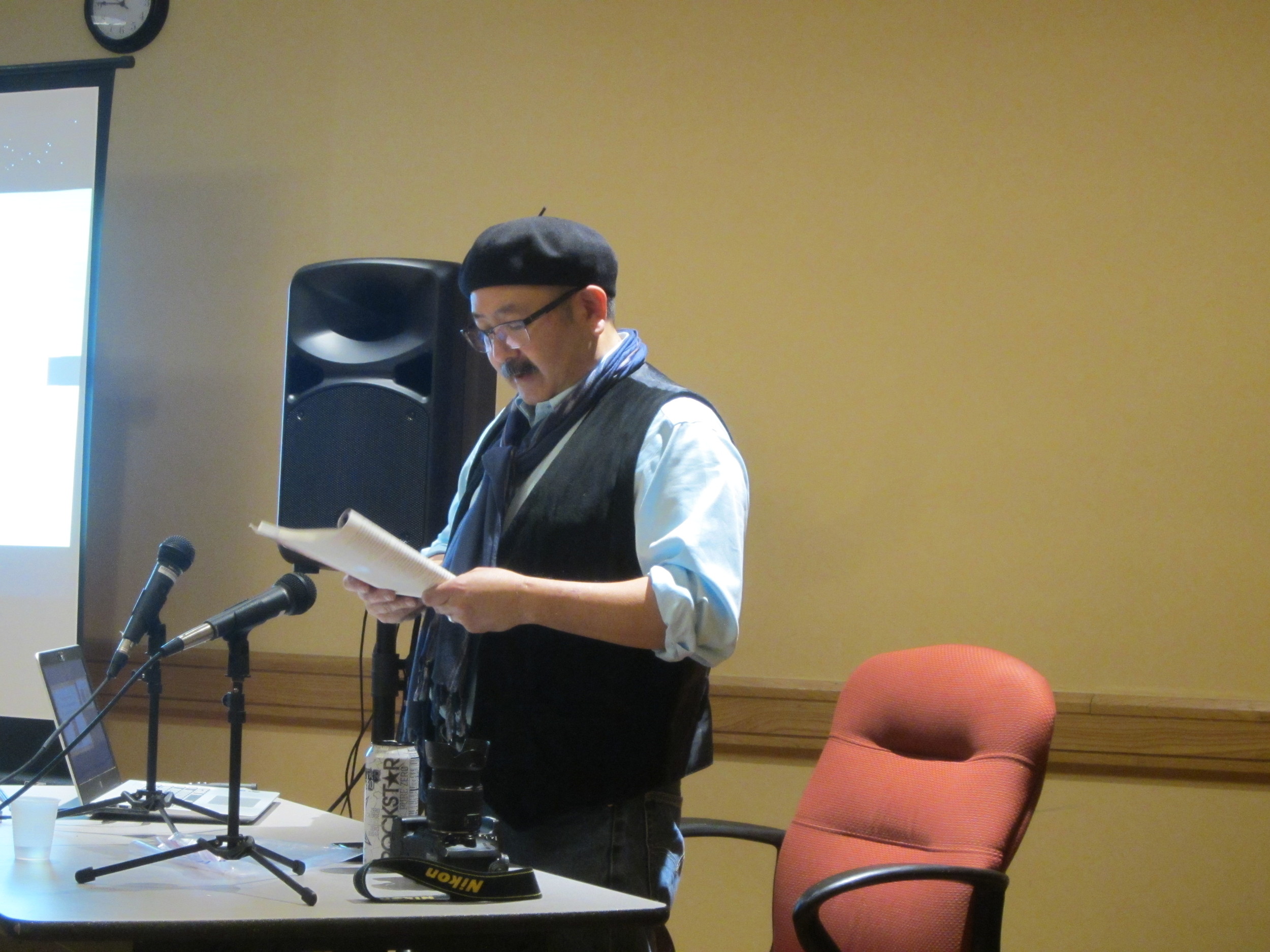 Gil Asakawa reading from his book Being Japanese American .