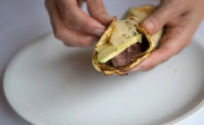 Cauliflower tortillas with steak, avocado, sauerkraut