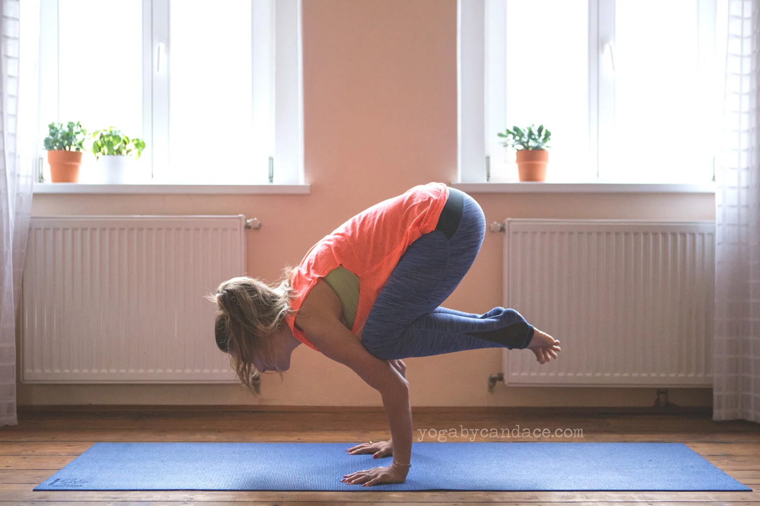 Crow pose wearing Sweaty Betty leggings and top c/o.