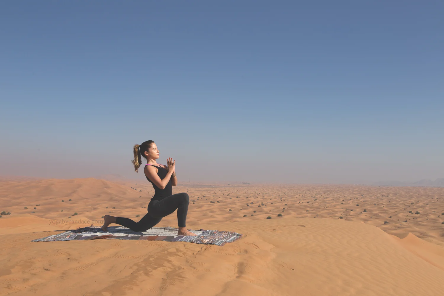 Low lunge in the Arabian desert Wearing: forever 21 leggings , splendid tank . 