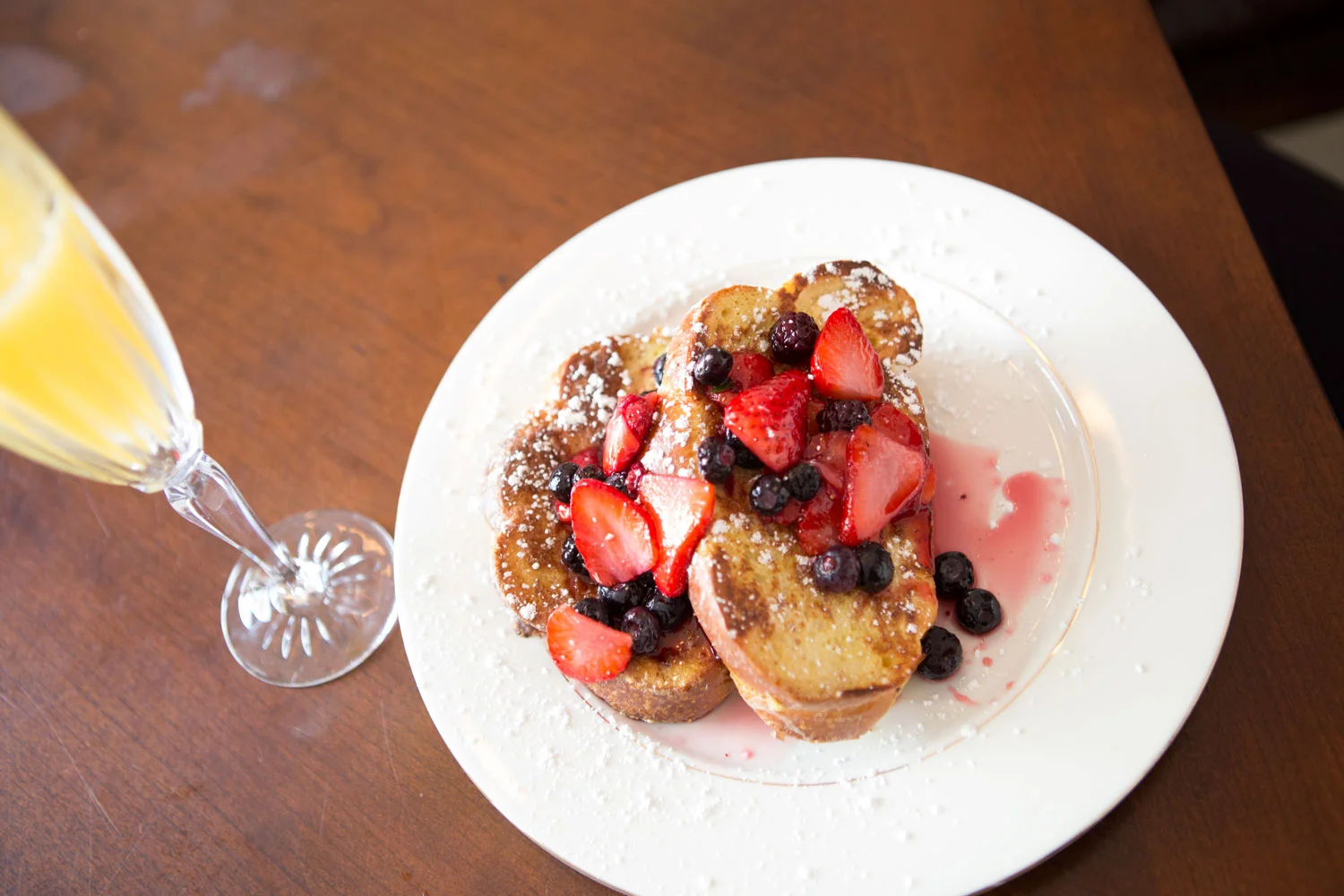 Breakfast- French toast with berry compote and mimosas.