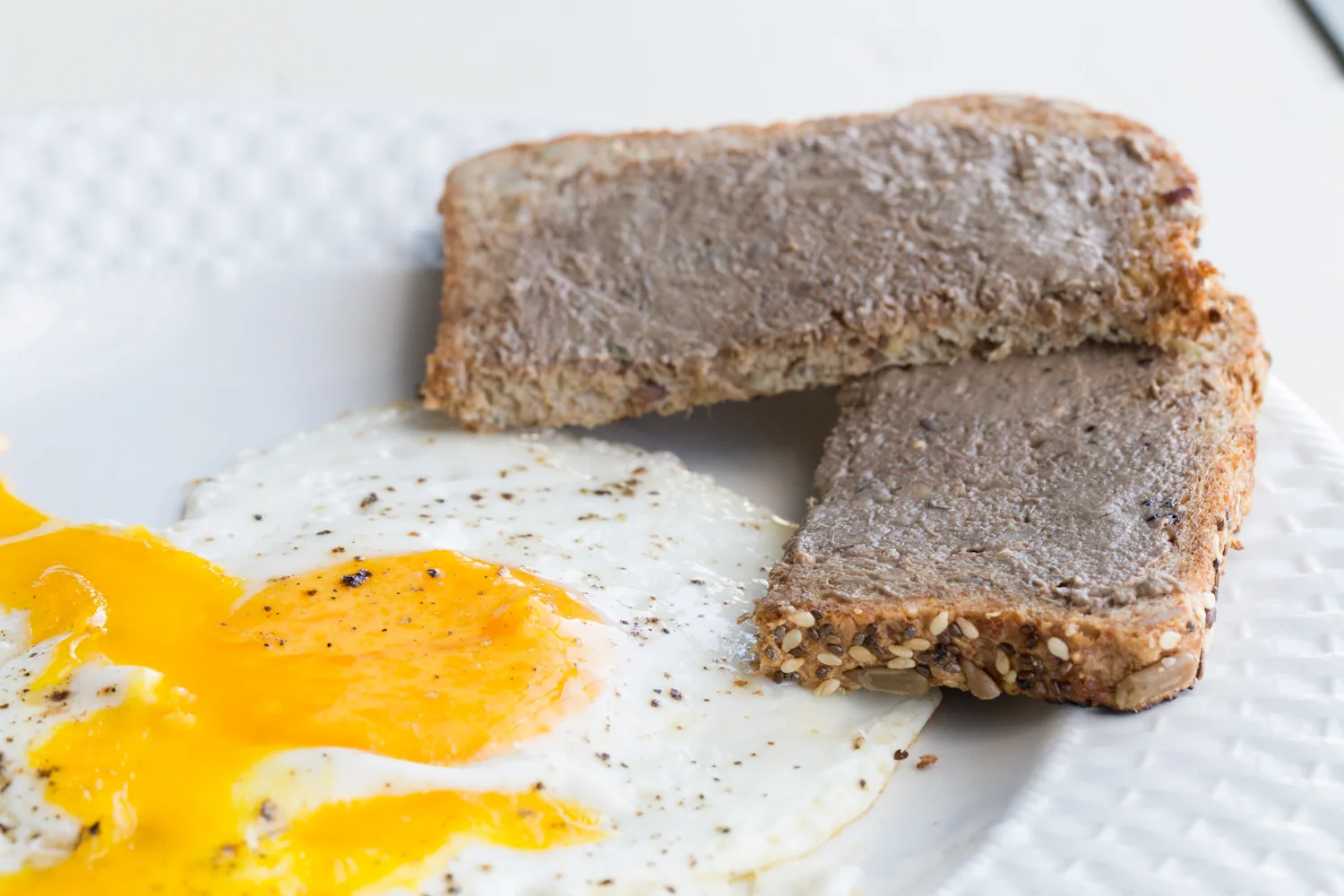 Liver pate on toast with an egg.
