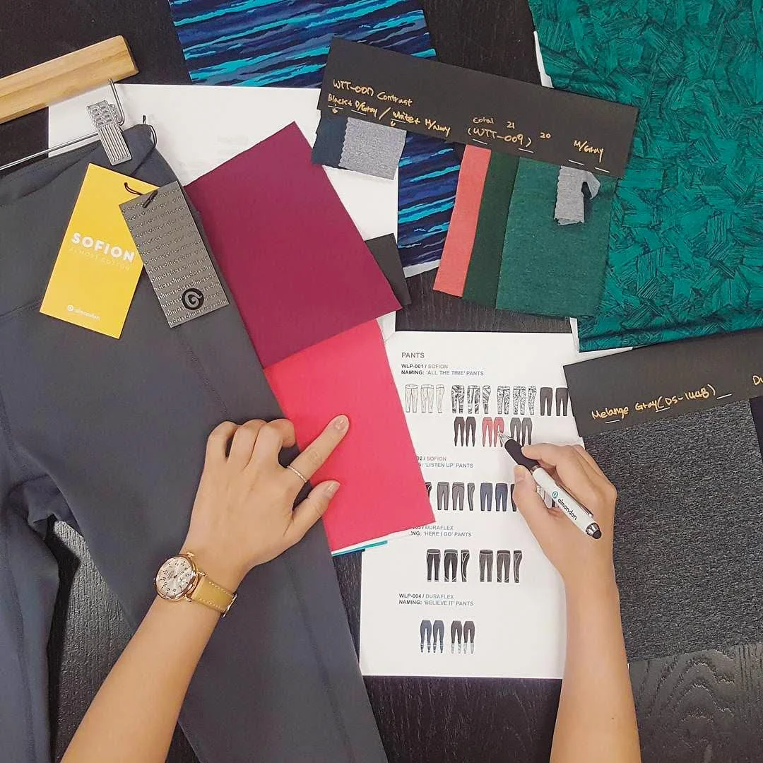 Joanne Yoo of Almondon, designing a sketch for the collection