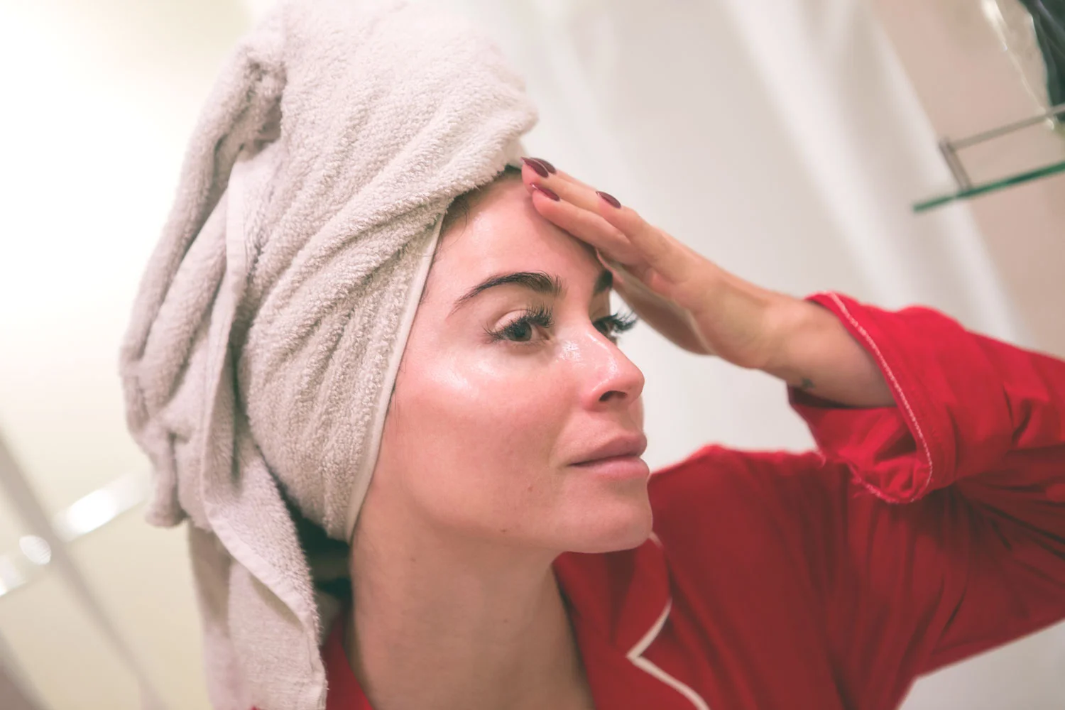 Patting the No. 1 Facial Oil into my skin