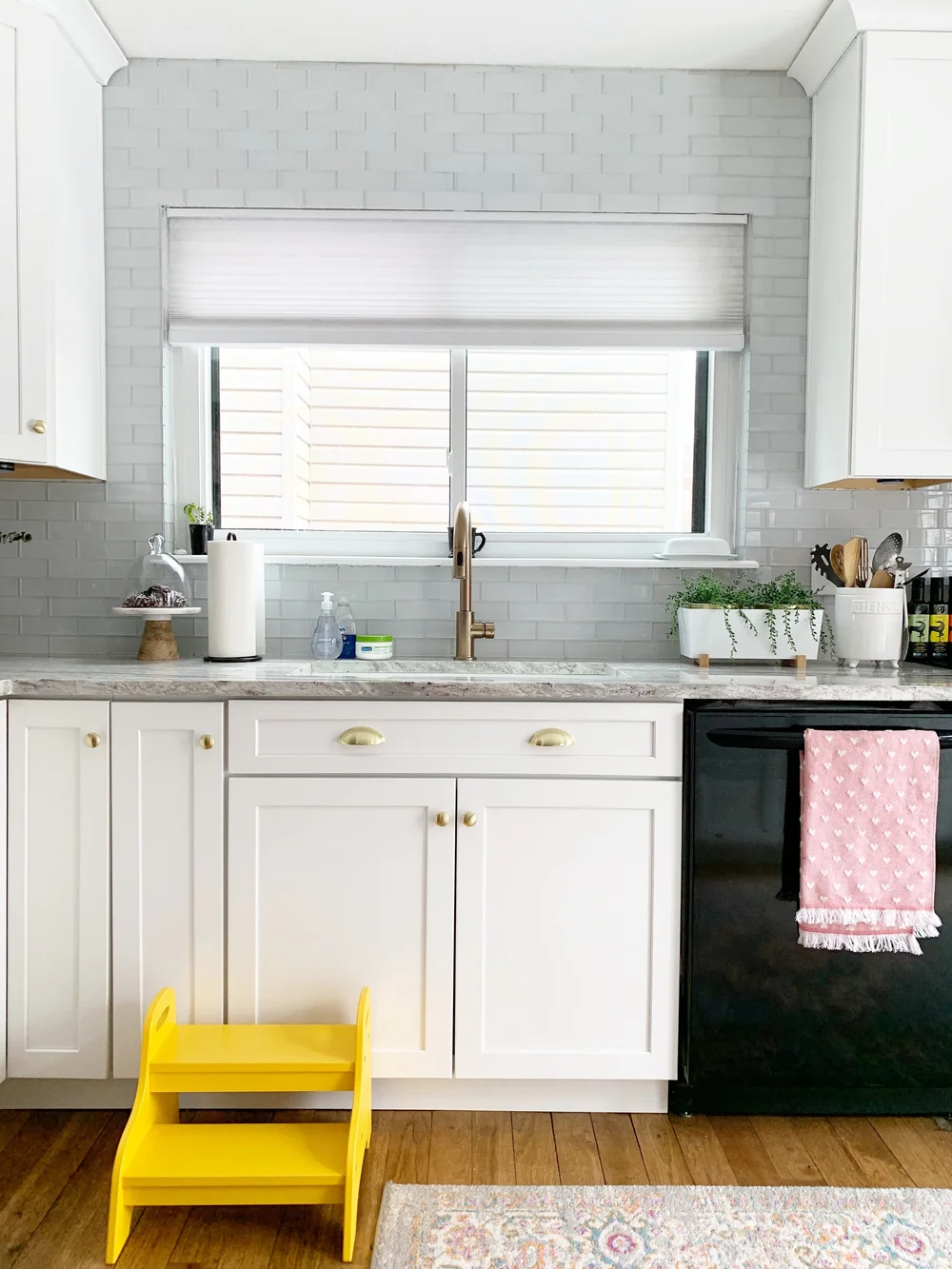 We also centered the kitchen sick to the window - it was off by a few inches before. Pictured: Marble and Wood Cake Stand ; White Utensil Holder