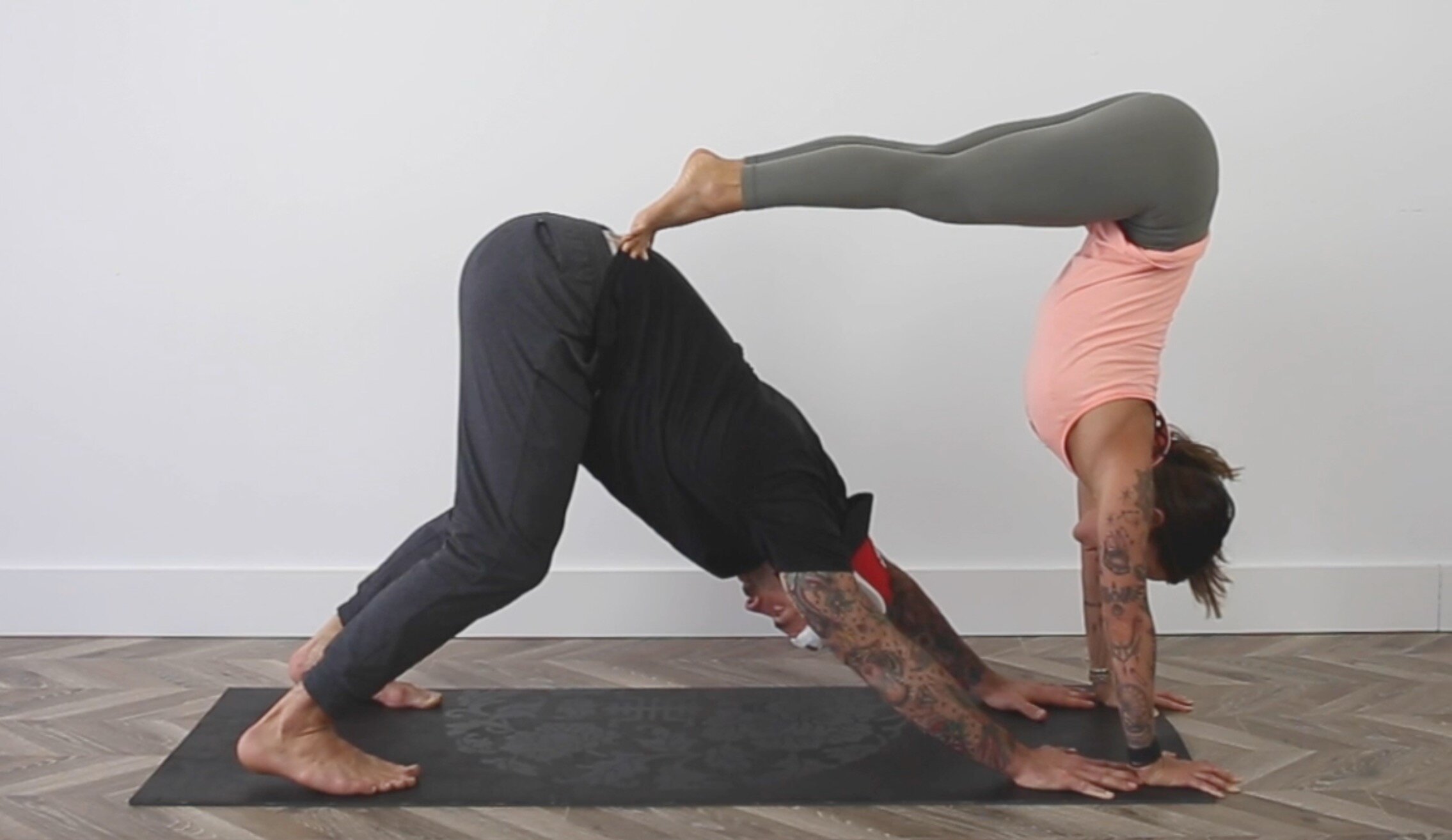 Premium Photo | Young couple doing acro yoga in pair