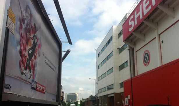 YOU'RE HAVING A LAUGH: Sky Sports promotional poster on Bramall Lane featuring Carlos Tevez and THAT goal!