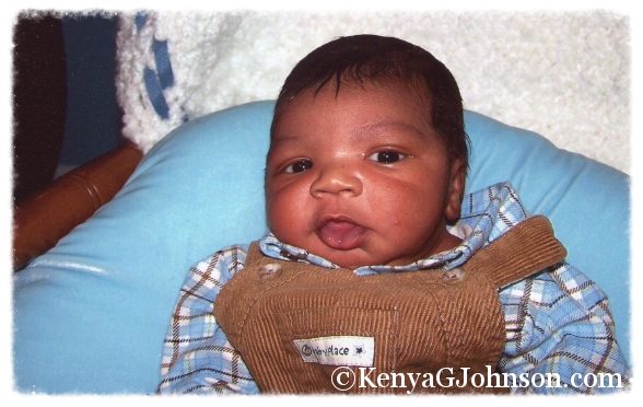 Christopher - December 2004 - Three weeks old propped up on a boppy in my grandmother's rocking chair. 
