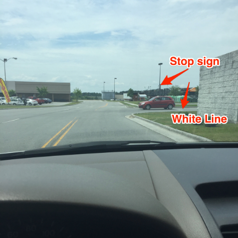 That red car is where I was when the cop pulled in front of me. From this perspective, he had room to drive by. This car is completely beyond the white line.