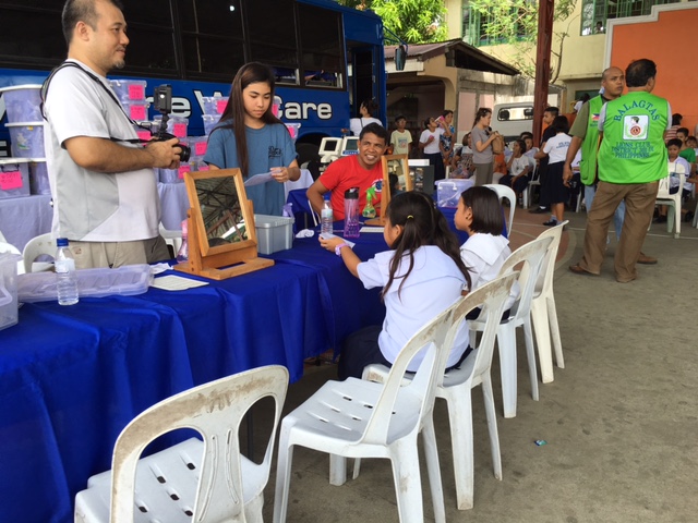 School kids receiving their first pair of glasses!