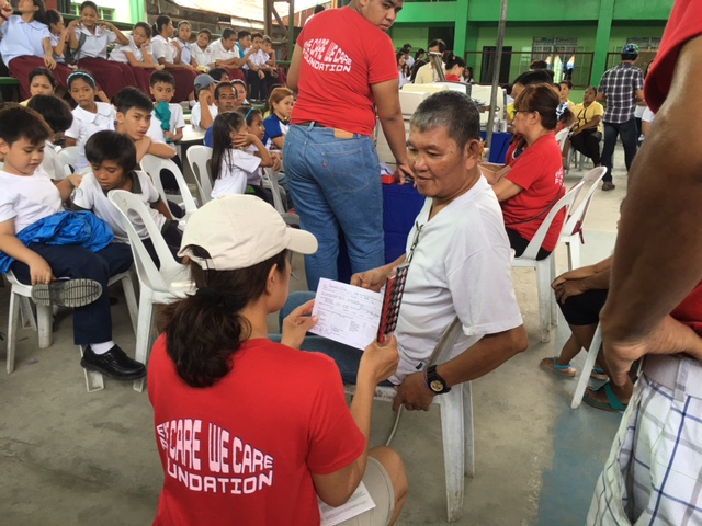This man is disabled due to complications of diabetes. Since he was unable to climb onto the clinic bus, Dr. Schmidt checked his eyes in the waiting area. 