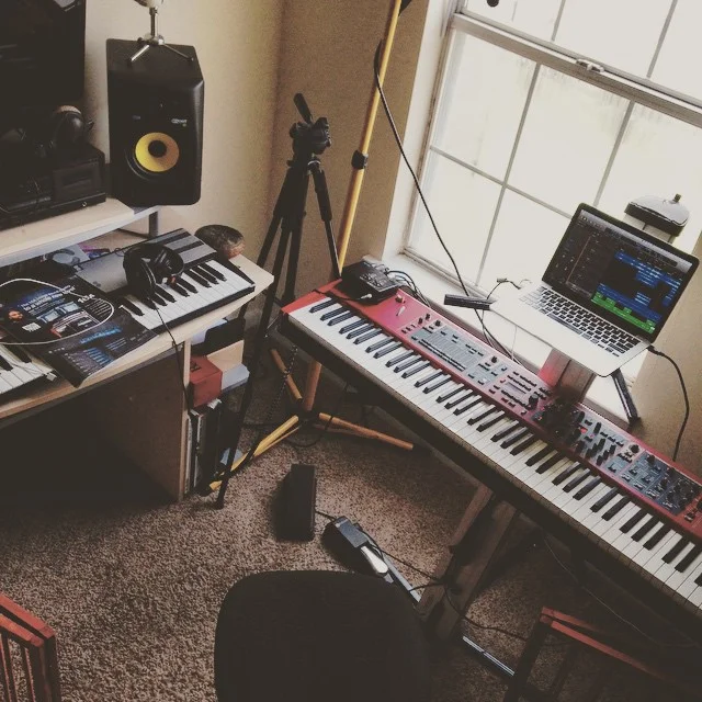 My current studio setup, which I've put together for speed. Included in picture: Novation MK2 controller, Nord Stage 2, Rokit Speakers, and Logic Pro. 