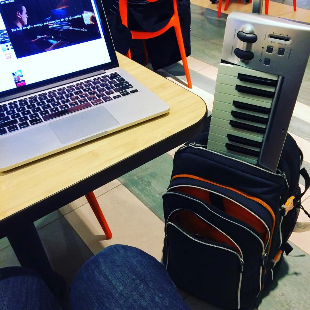 Sitting in the airport, waiting to board a flight. 