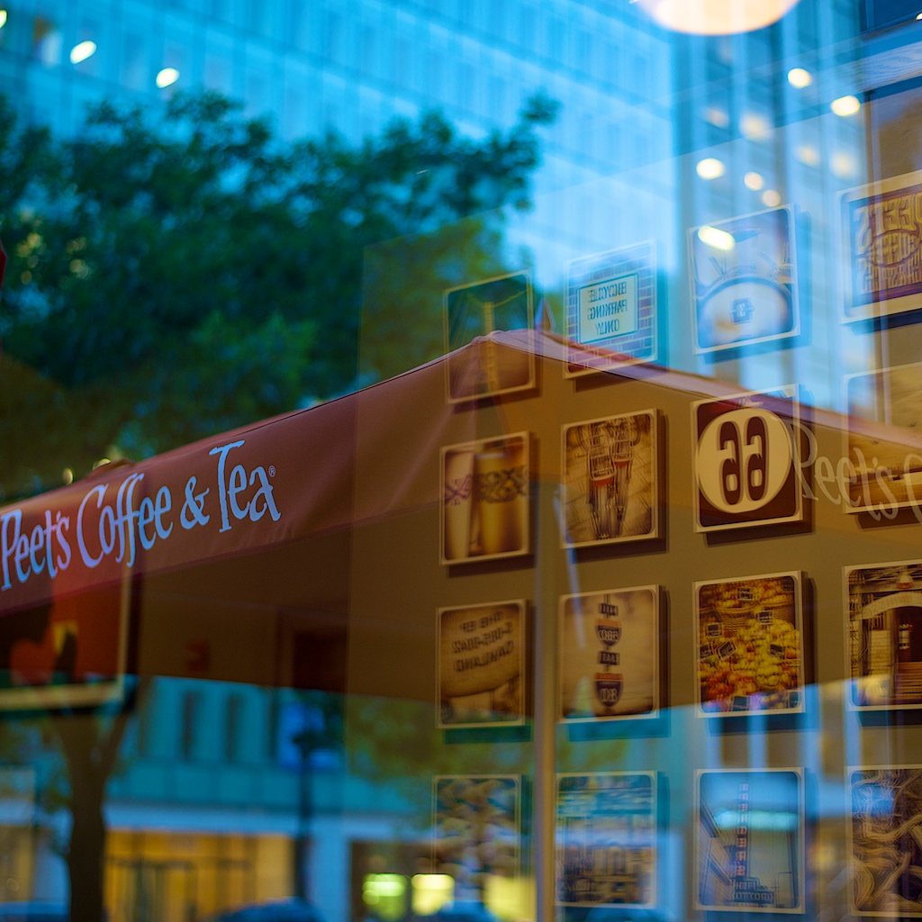 A reflection of the Instagram wall as seen through the window.