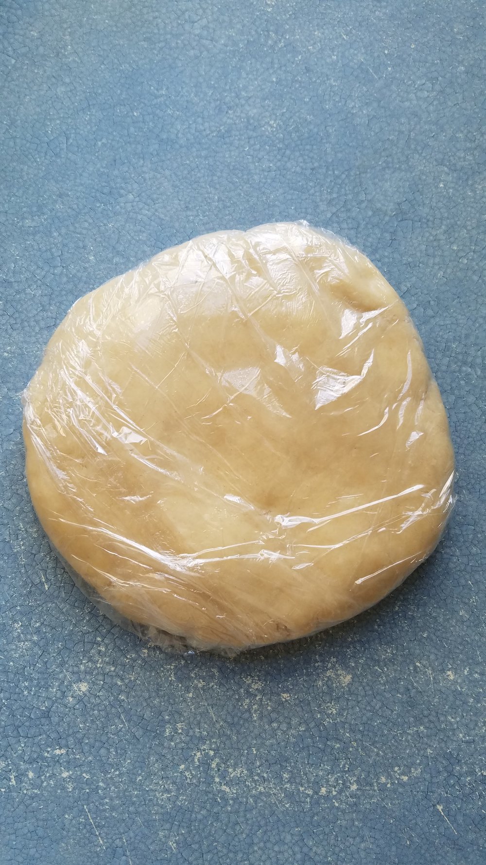 Form into a roll, ball, or disc cover with plastic wrap and refrigerate