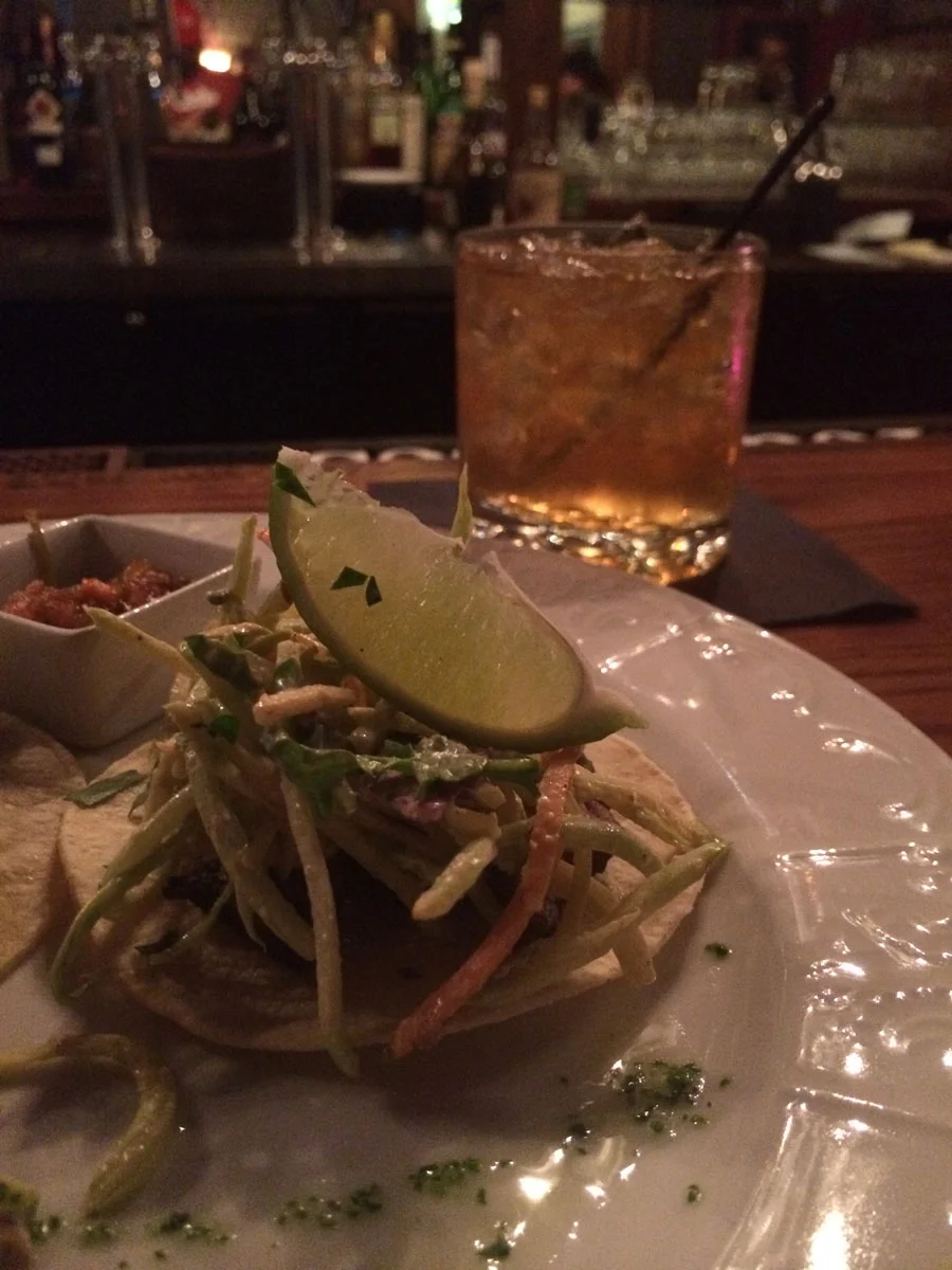 Happy Hour Chimmichurri beef taco and a Stone Fence cocktail made with Whitewood Cider & Four Roses Bourbon.