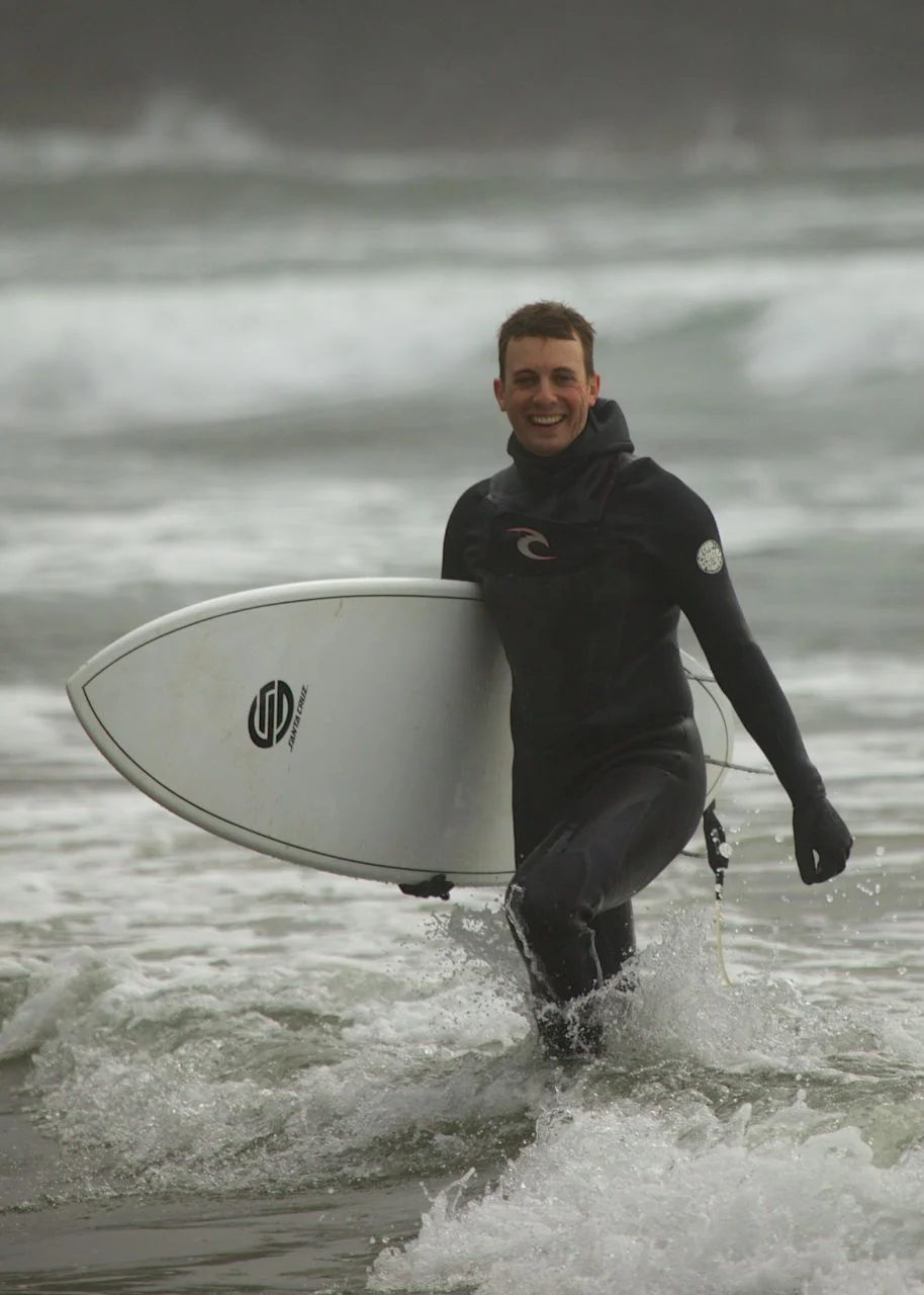 Fergus surviving the surf one more time.