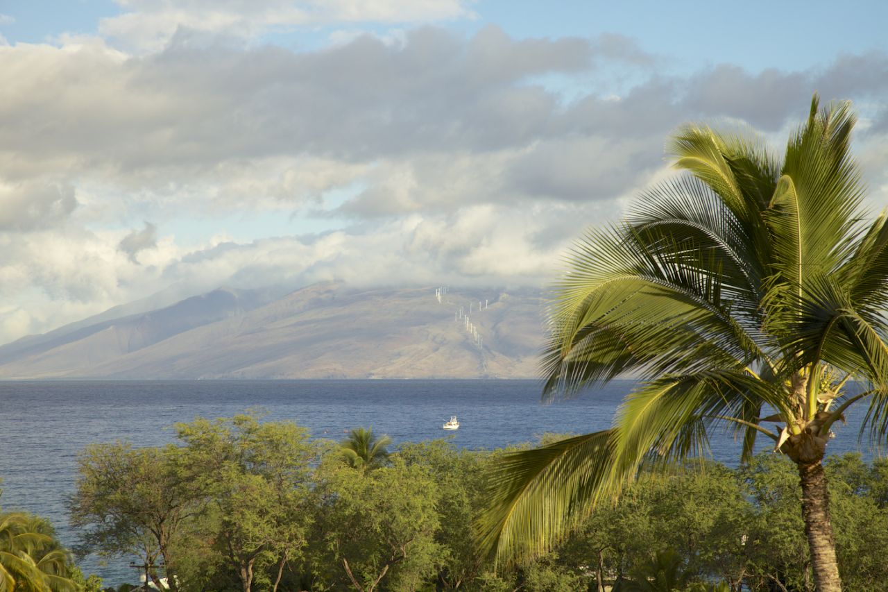 ​The view from our lanai (patio), looking out over the blue waters of Maui, towards the north end of the island.