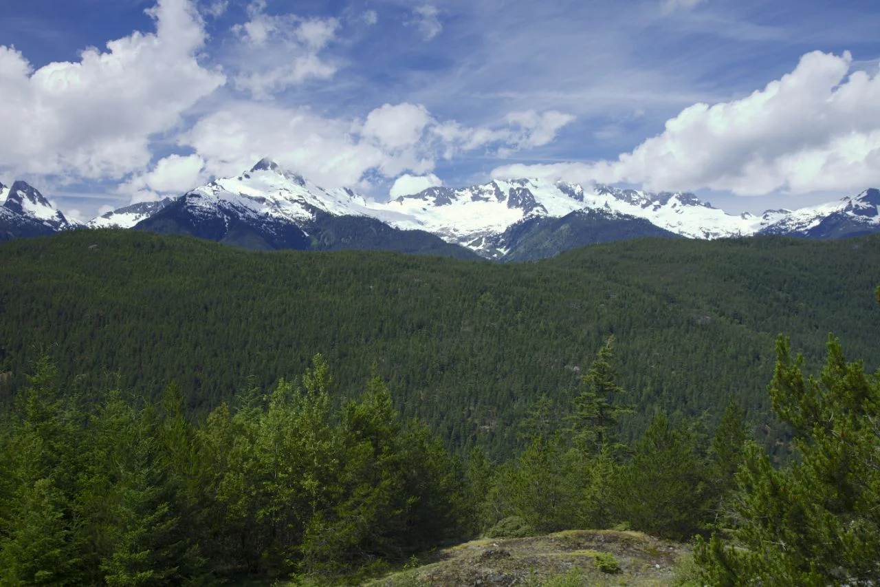 A view west from the highway provides a scenic view of the local mountains.