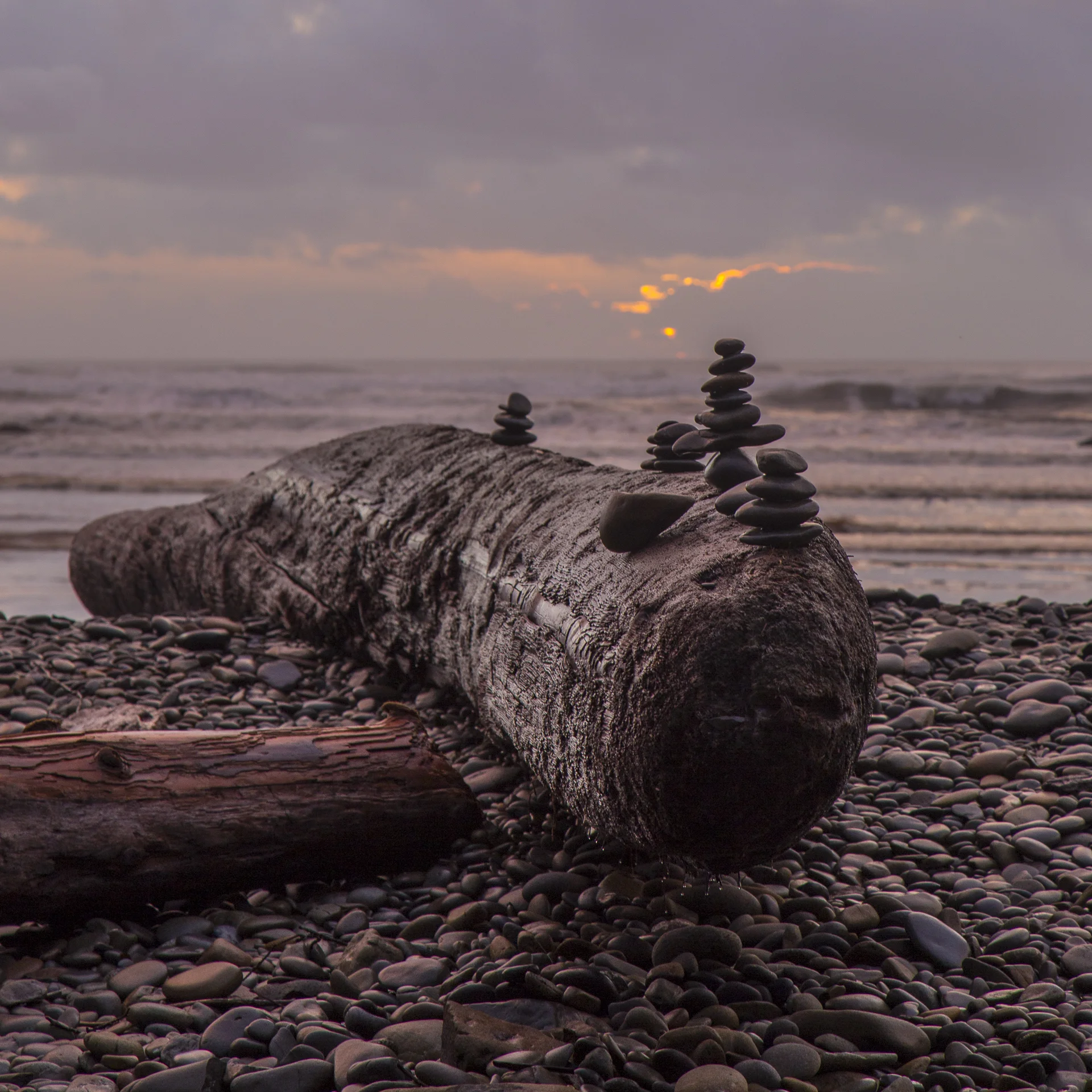 Rock sculptures on Ruby Beach as the sun sets.