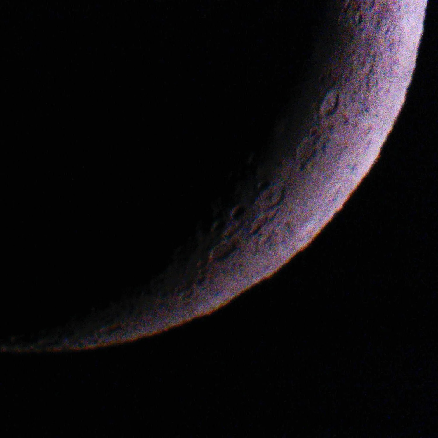 With my big lens, zoomed all the way in on the moon. I don't think I got the focus quite right, but it's hard this zoomed in.