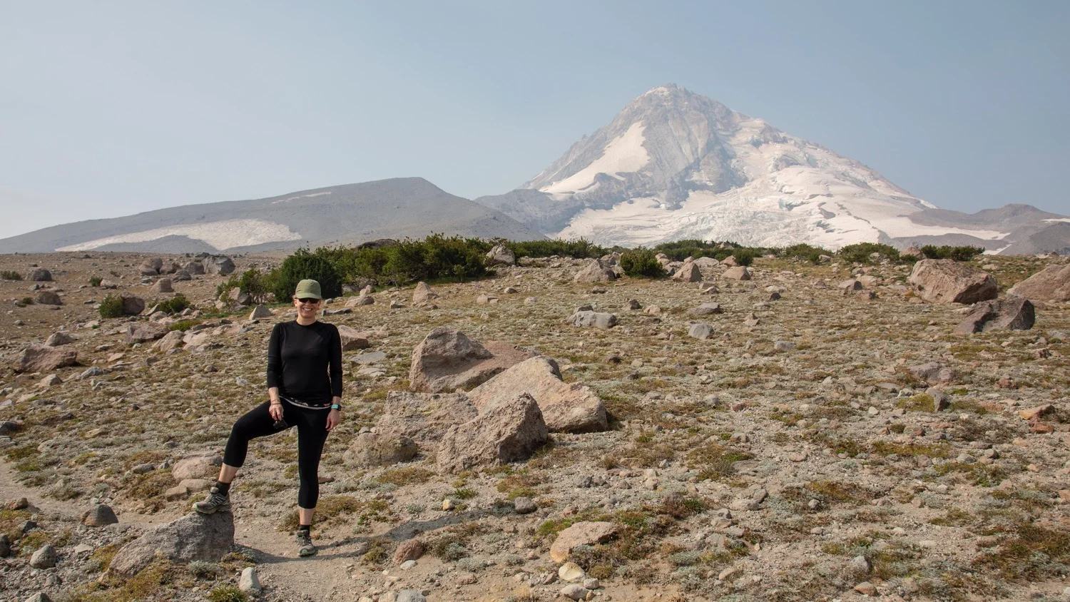 Justine posing in front of the mountain.