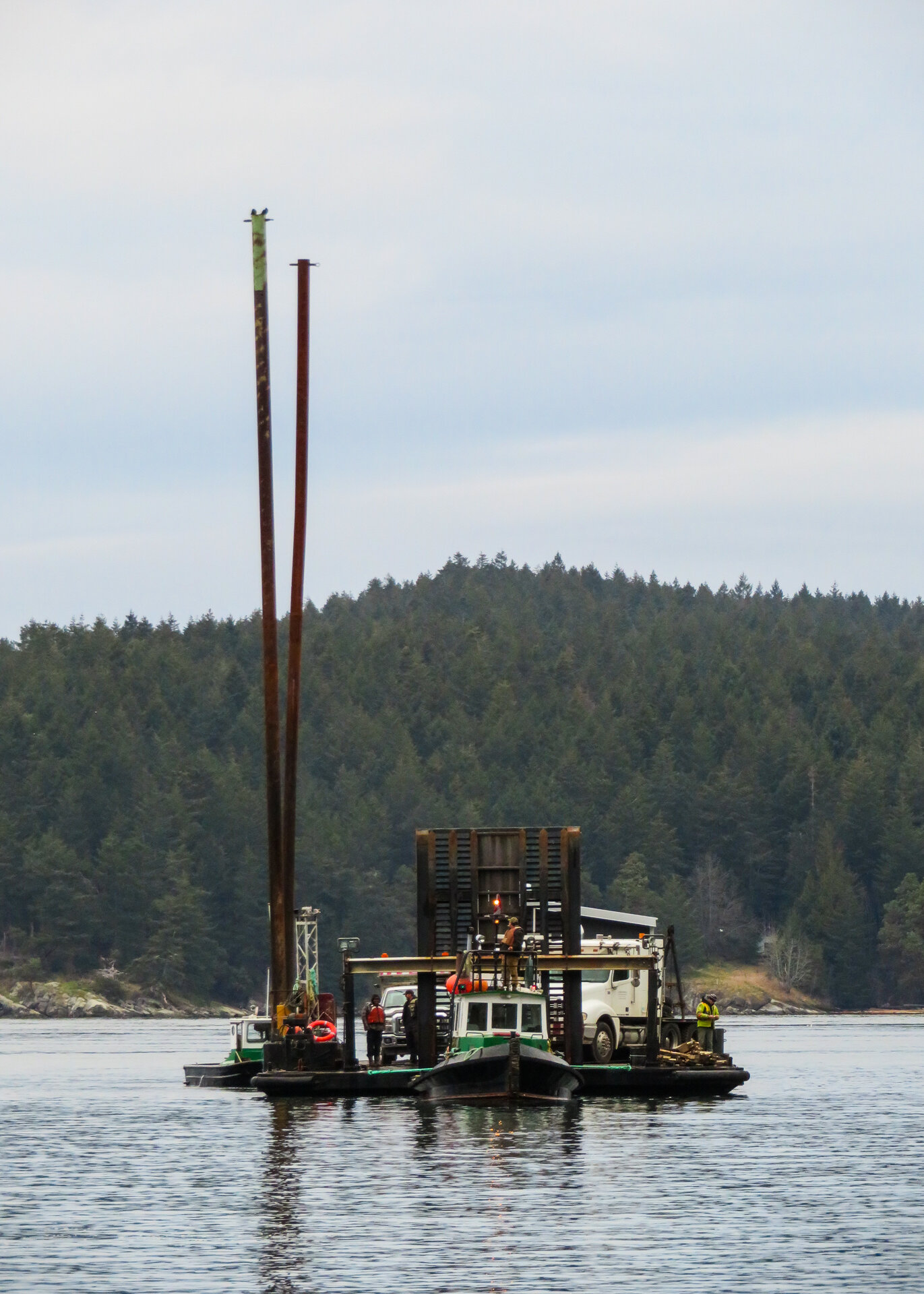  Barge being pulled by the larger tug. 