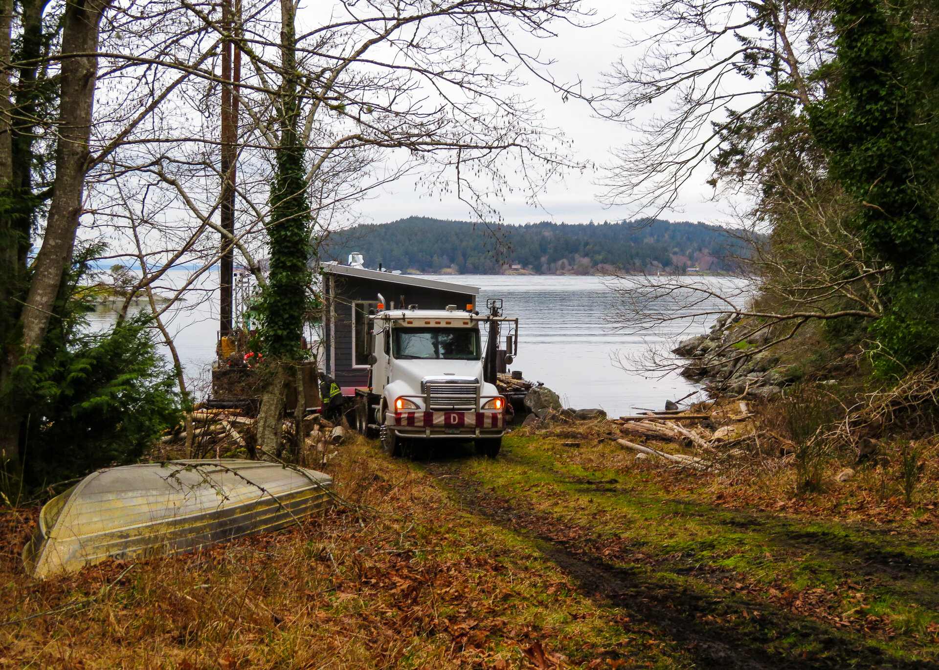  Once the pilot and support trucks were off the barge it was time for the big truck and the cottage. 