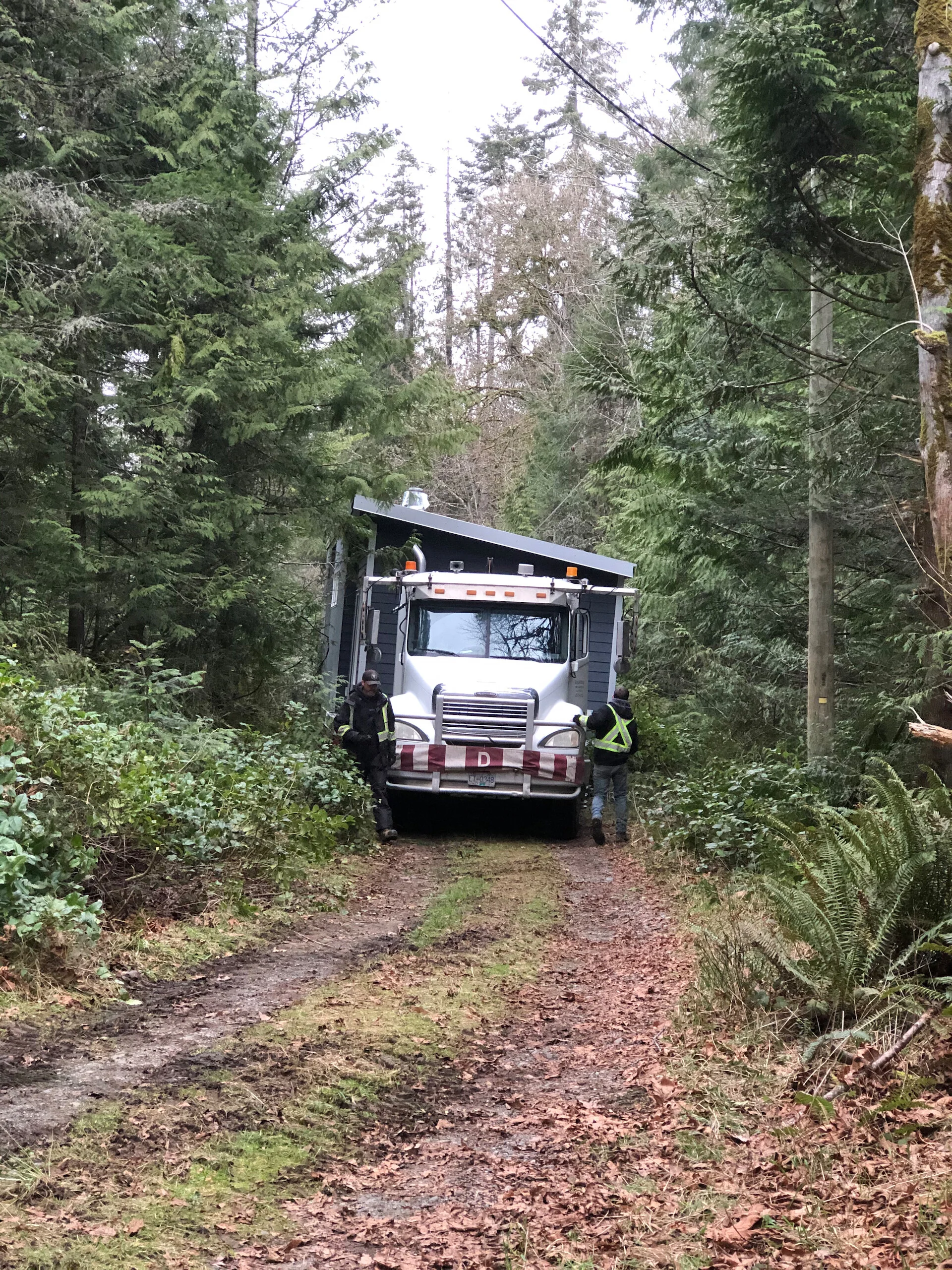  About half way, the ground was solid enough that they were able to disconnect the backhoe and the truck was able to make it’s way on it’s own.  