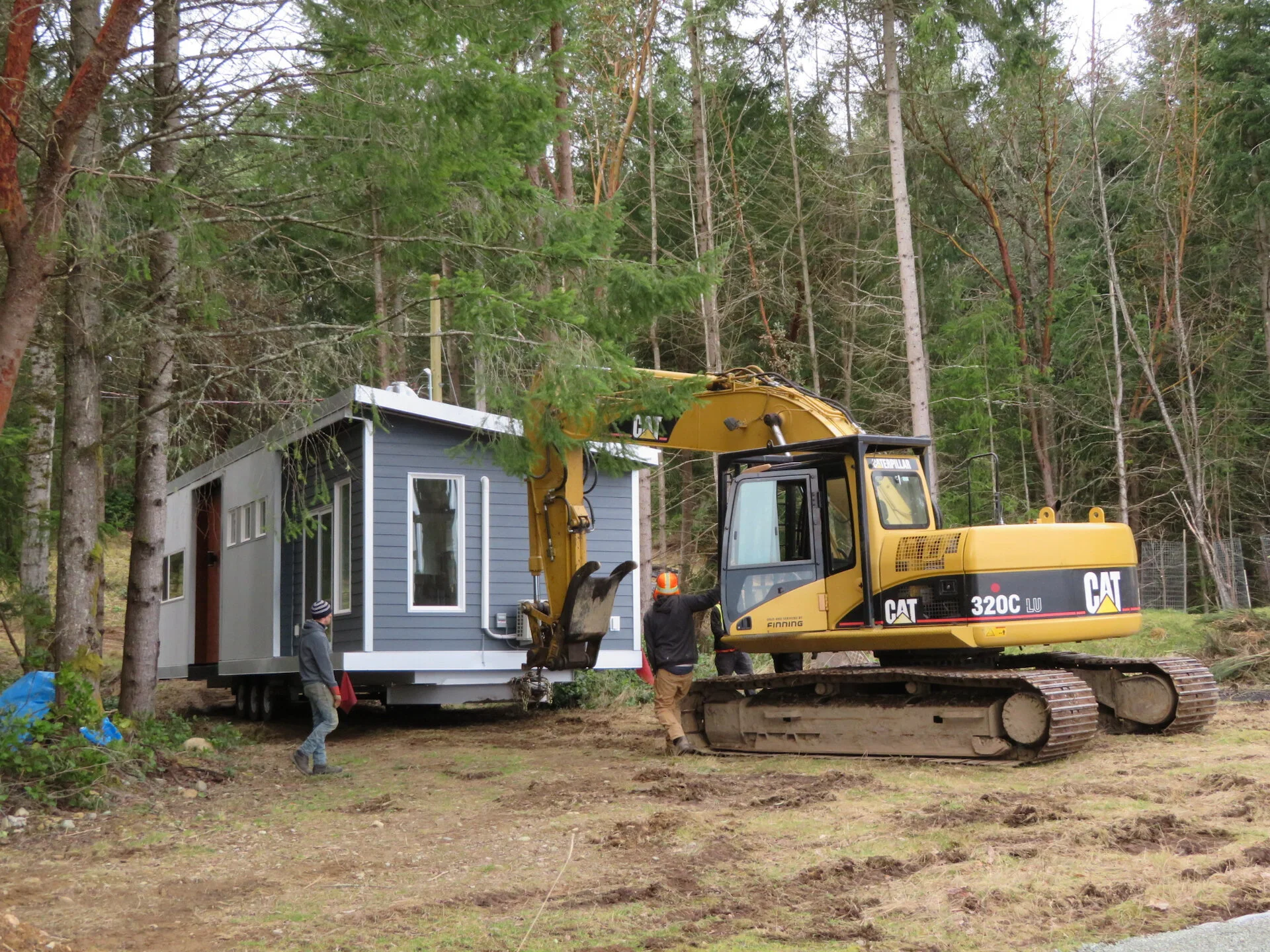  They used the excavator to get it around the tight bend in the driveway. 