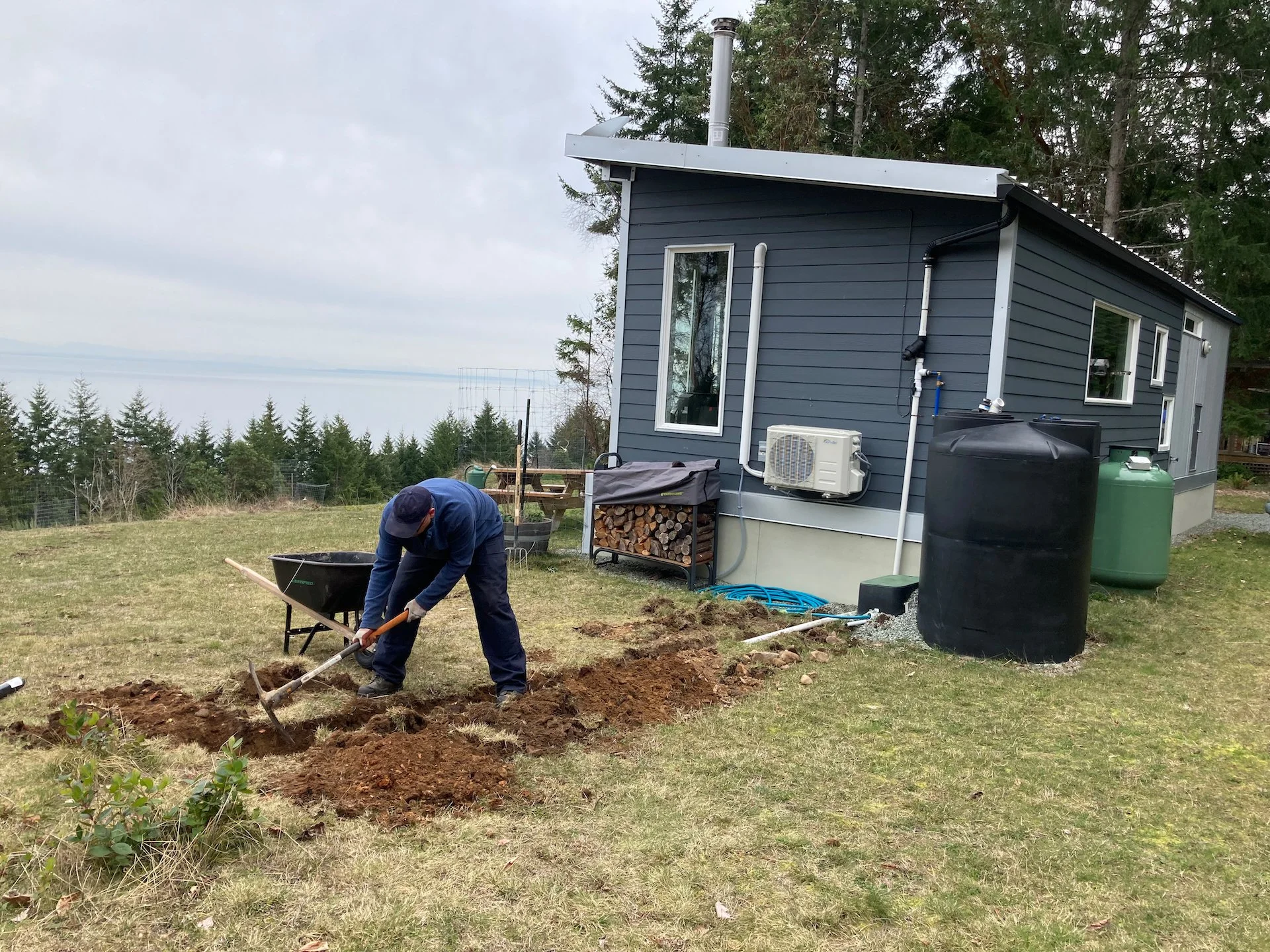  It’s hard work digging a trench, especially in our rocky soil. Shawn would say we should be using a machine… 