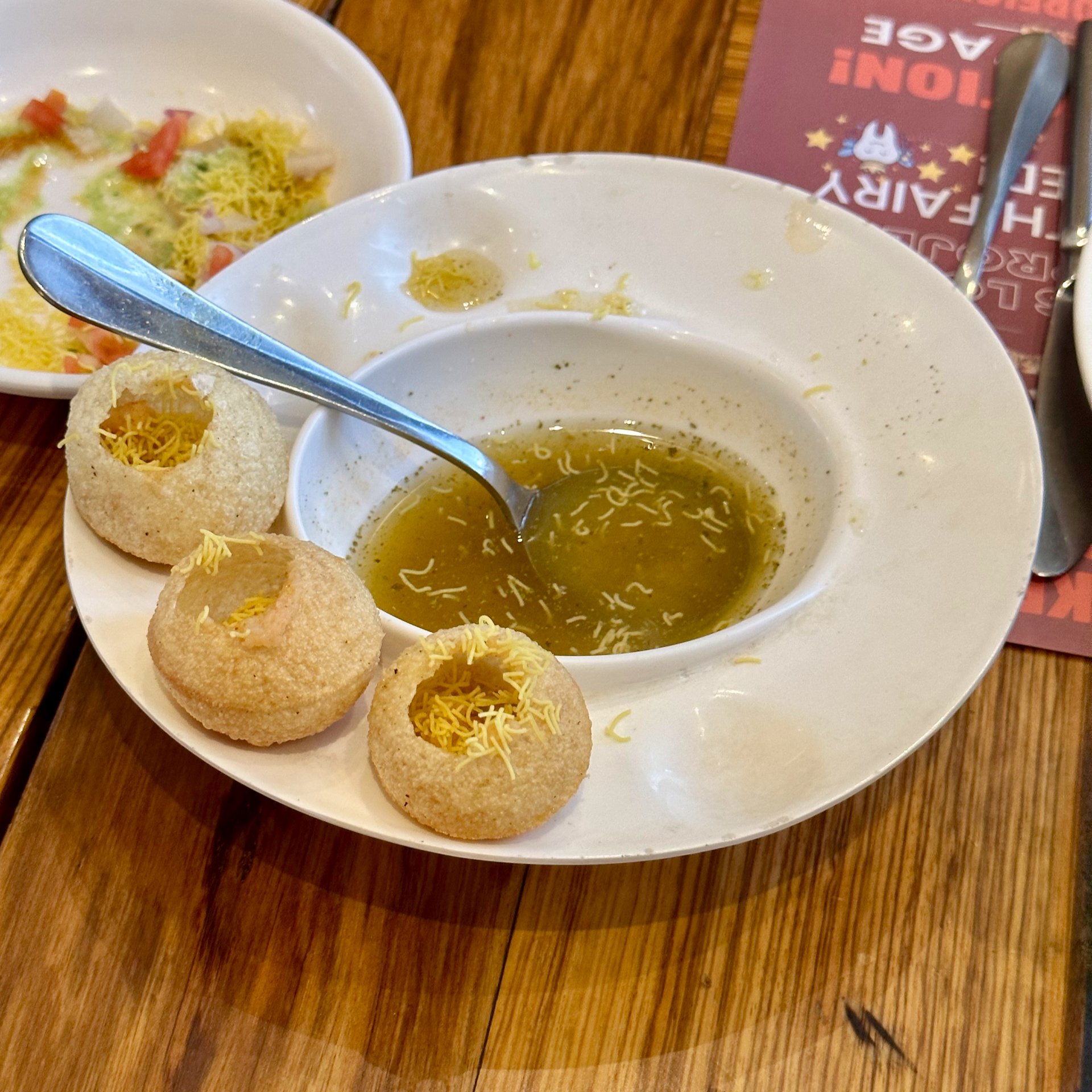  We had this appetizer which was made up of these small puff pastries that they break the top open on and fill with this very fragrant liquid. I saw them frequently on the streets at various food stalls, so it was a fairly common food item.  