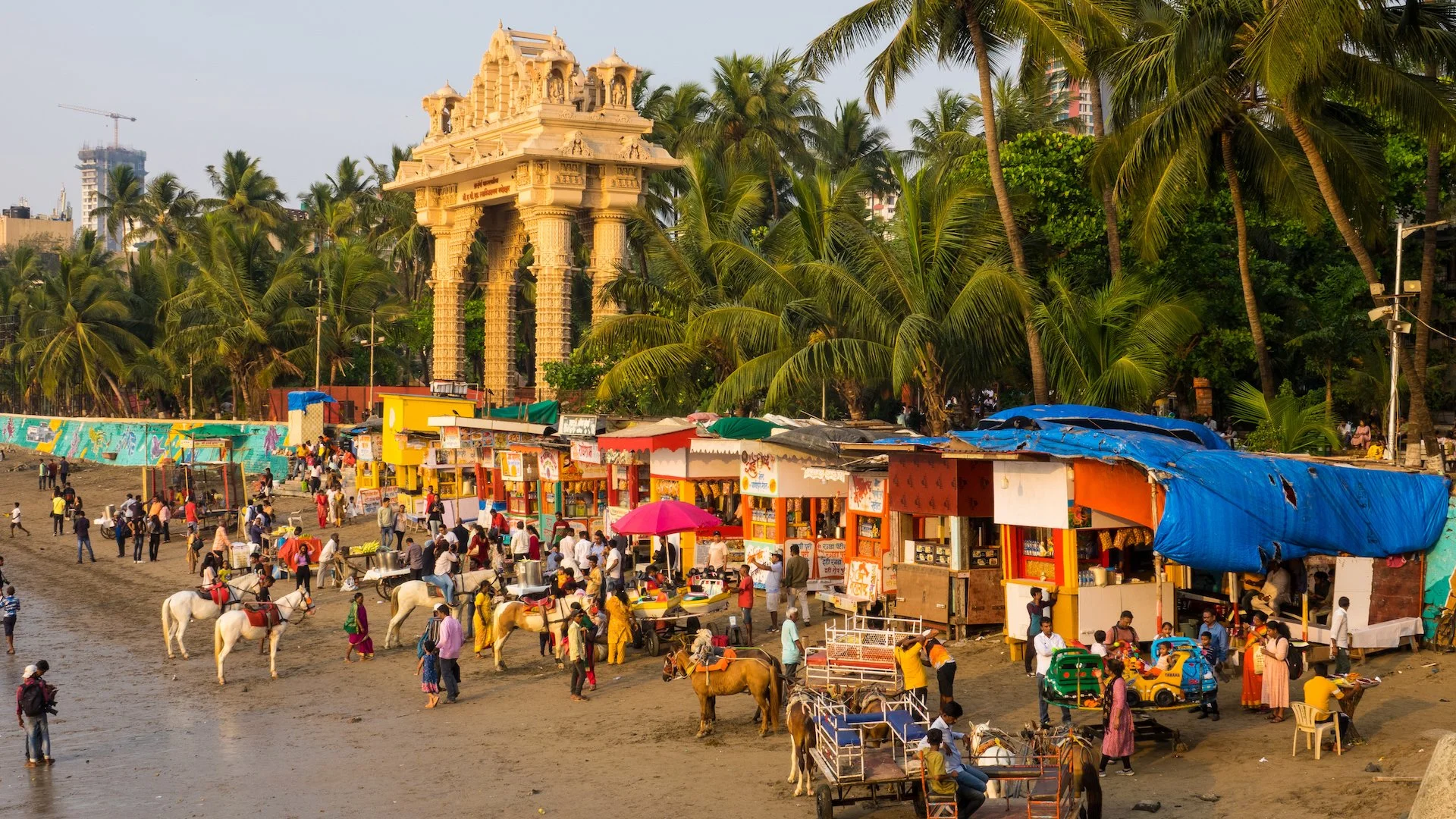  There were a ton of little stalls set-up along the beach, and for whatever reason, horses for people to ride along the short stretch. But everyone seemed to be having a good time.  