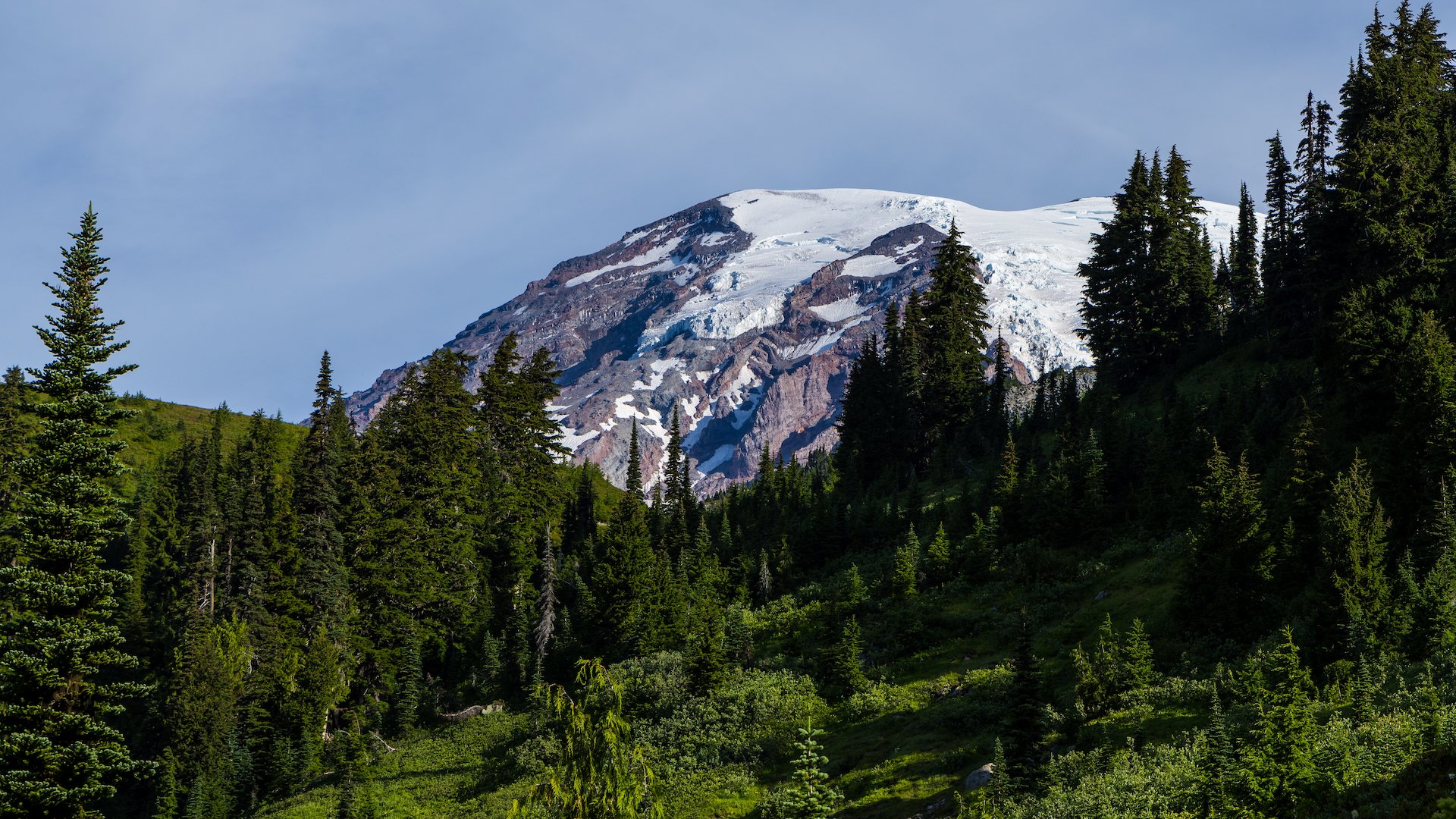  The snow and glaciers on top of the mountain. 