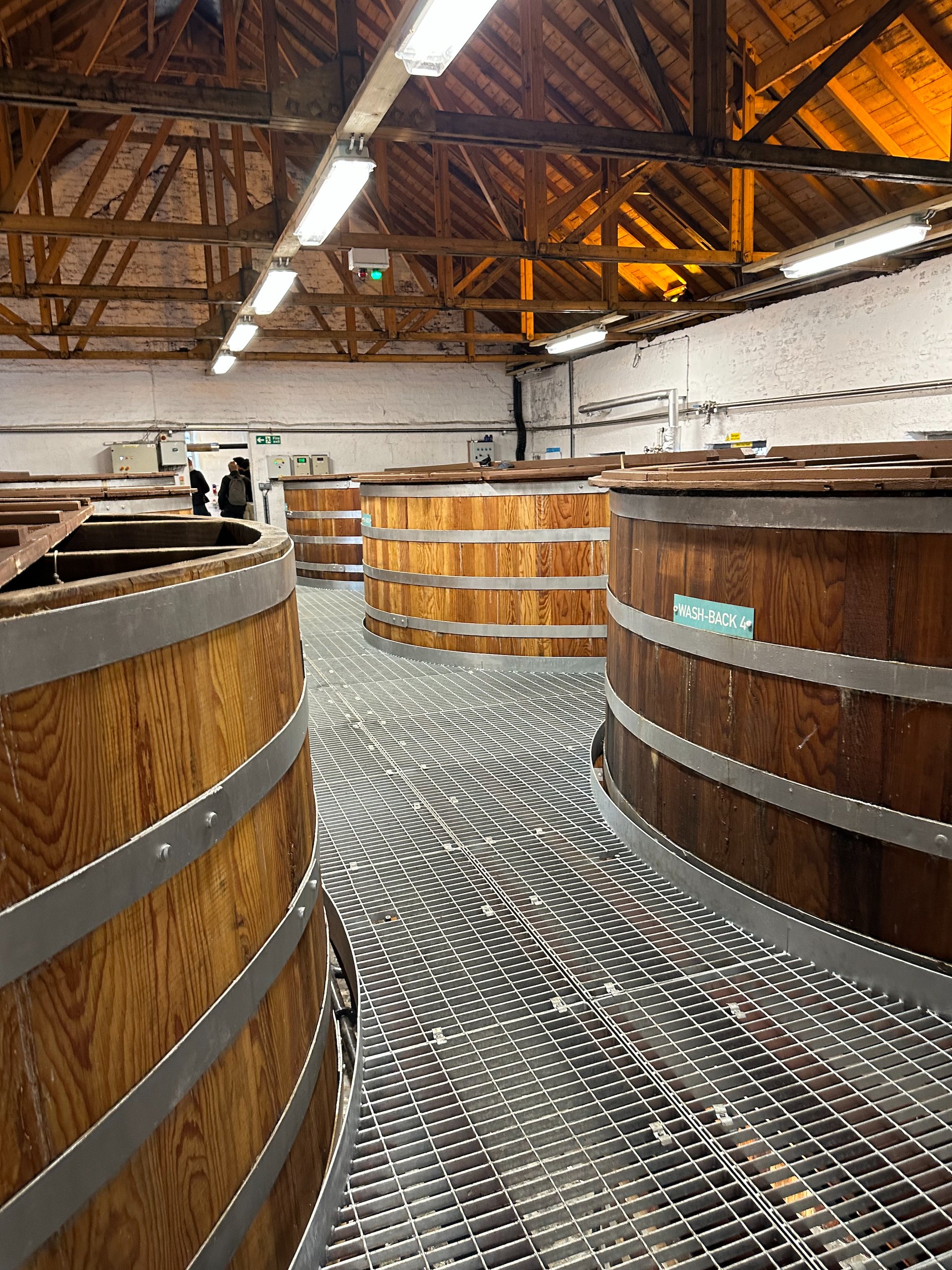  These huge wooden barrels are part of the process, before it goes to much smaller barrels for the long-term aging.  
