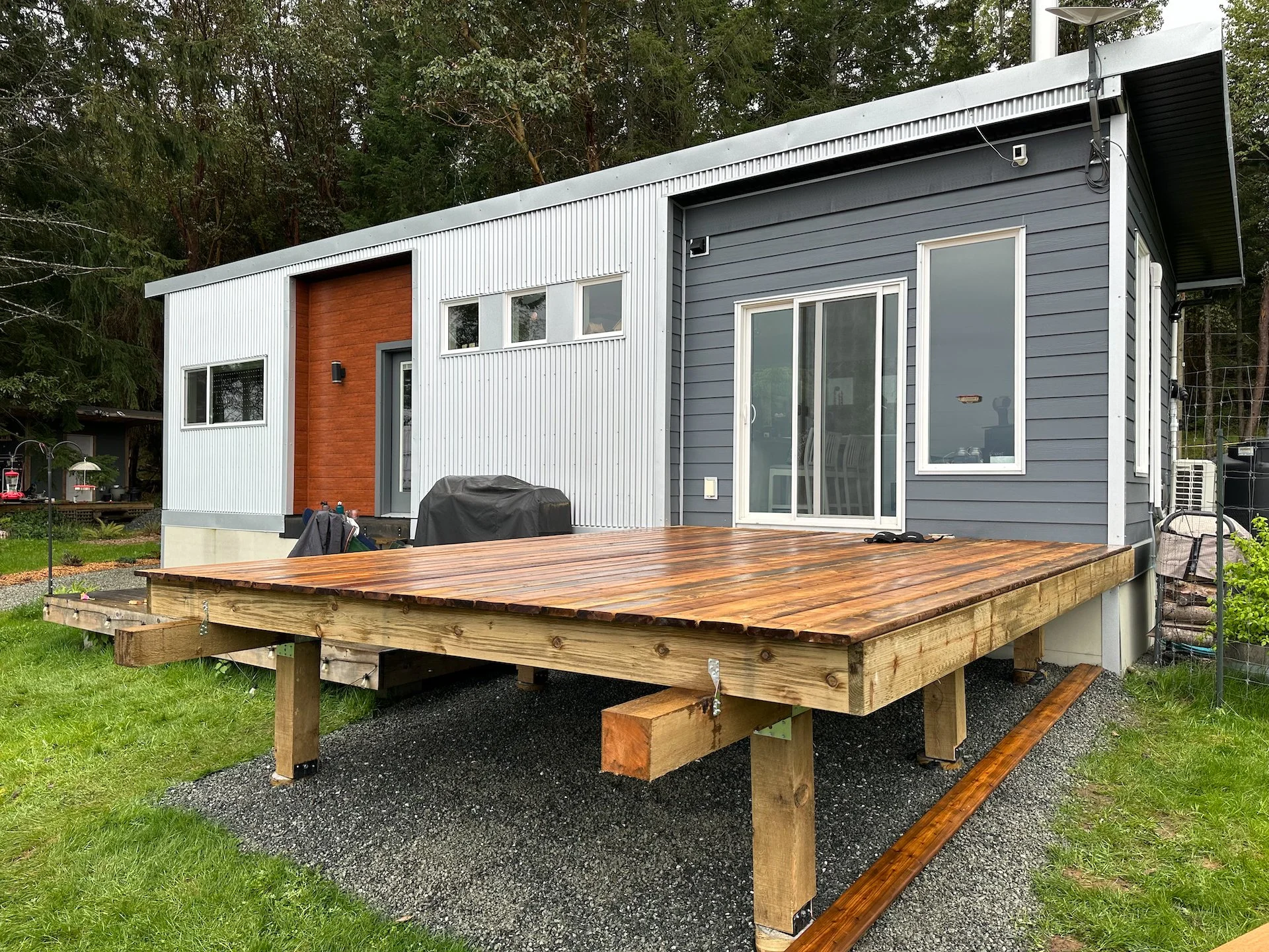  This phase complete! We have a deck. There’s still a few more things that we need to do - stairs to the lower deck, a roof over part of it and railings. And we have some interesting ideas for what to do with those two beams sticking out…  