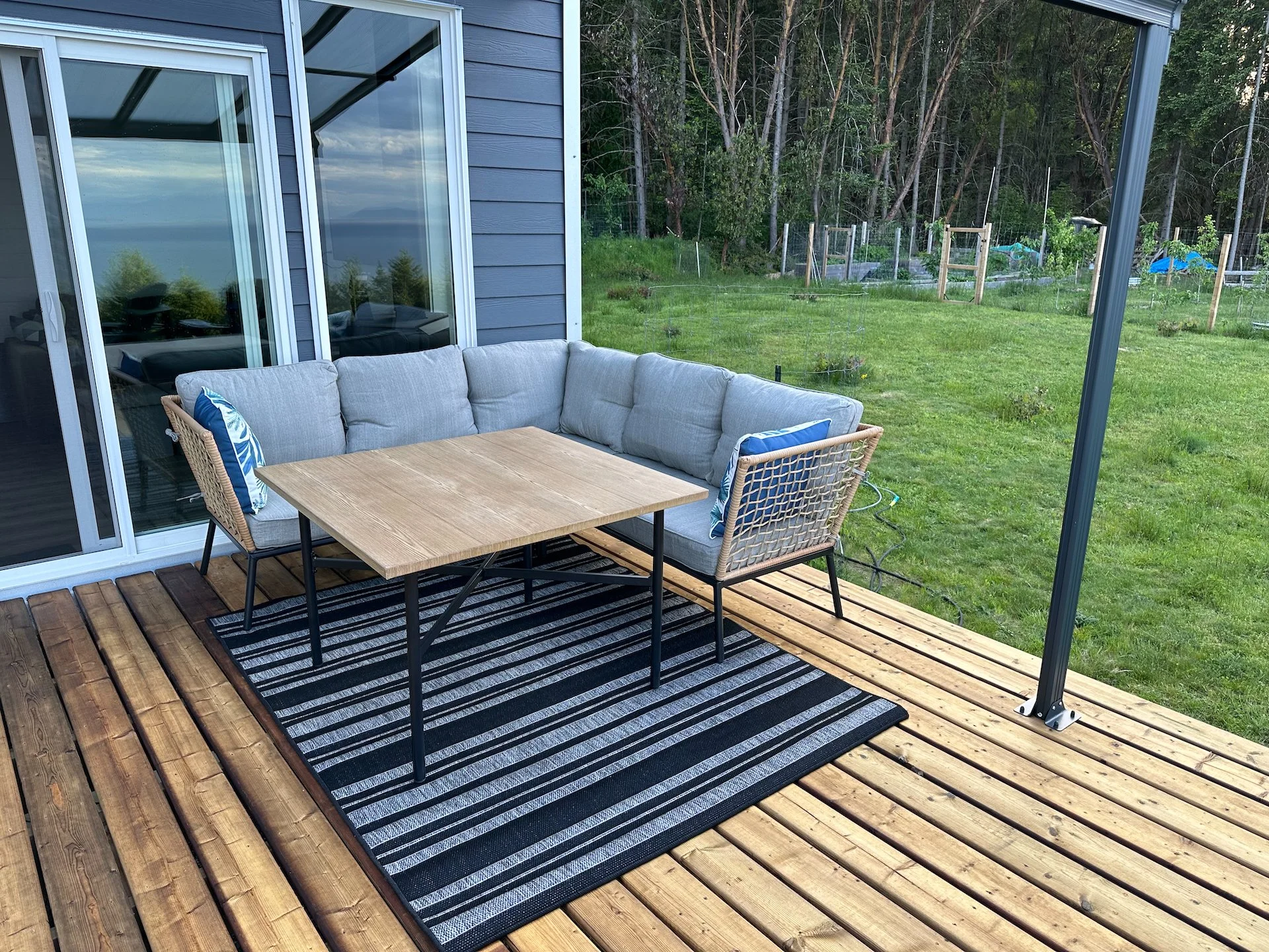  The new patio set. It's small, but fits well in the space and matches everything quite well.  