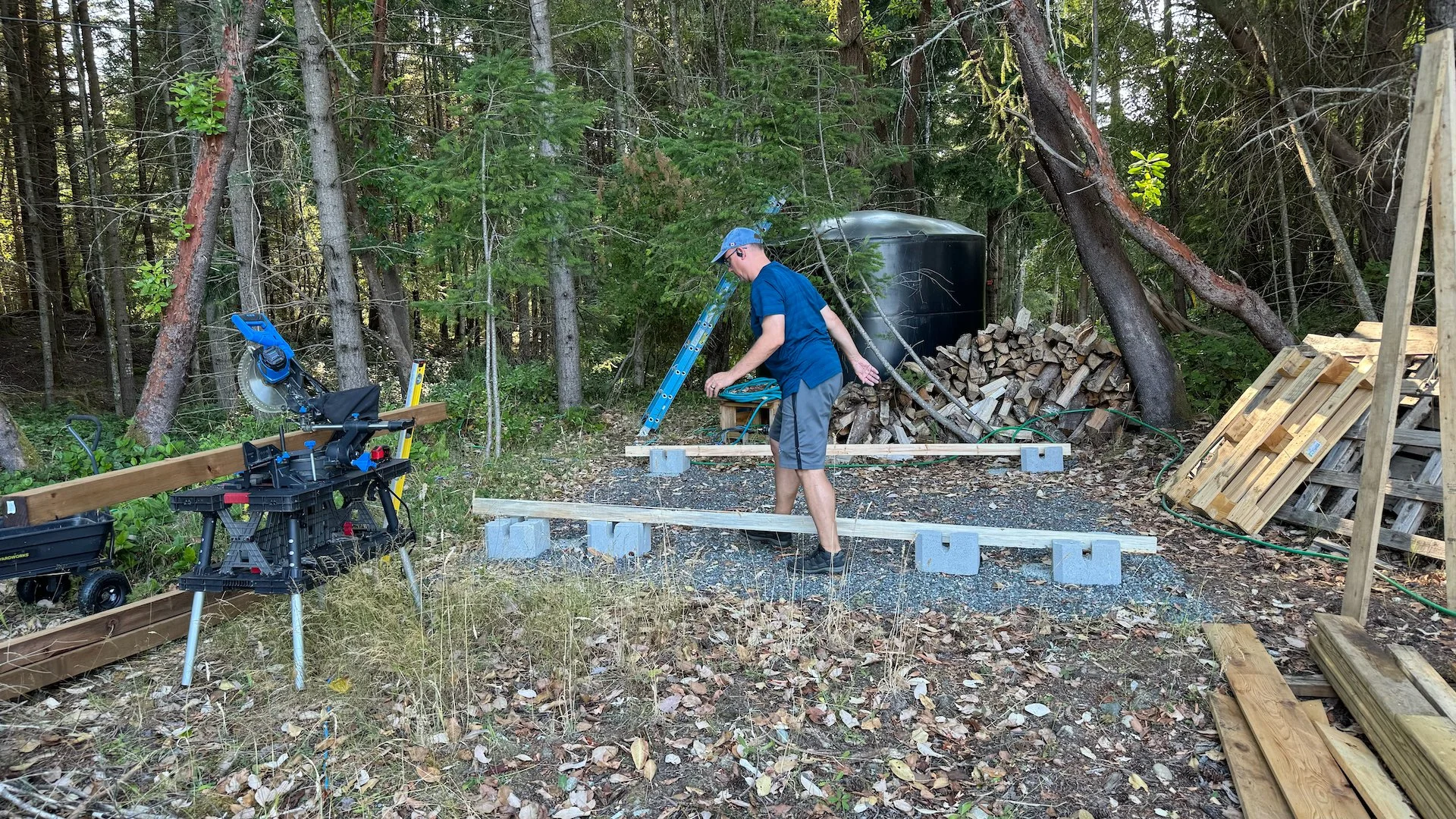  We decided to go with a fairly simple design, just using cement blocks as the "foundation". We went for about 10' x 10' and 8' tall at the front, thinking that will give us lots of storage. 