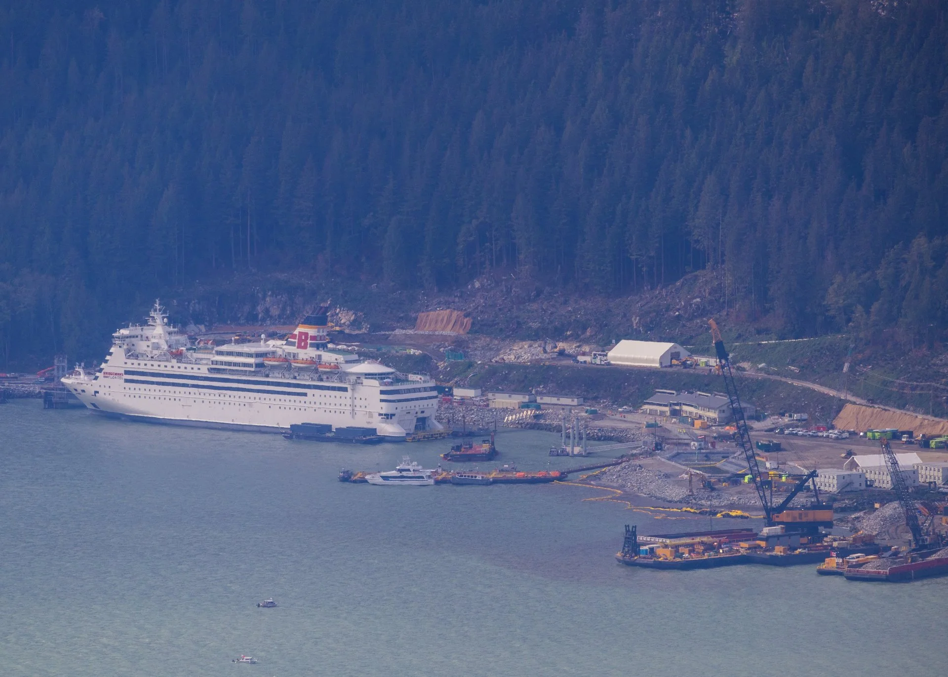 Zooming in, you can see the cruise ship they have docked at the site to house the workers on the project.