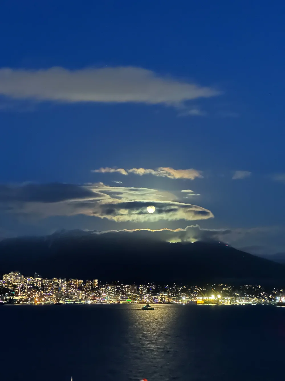  The full moon, playing hide-and-seek with the clouds. 