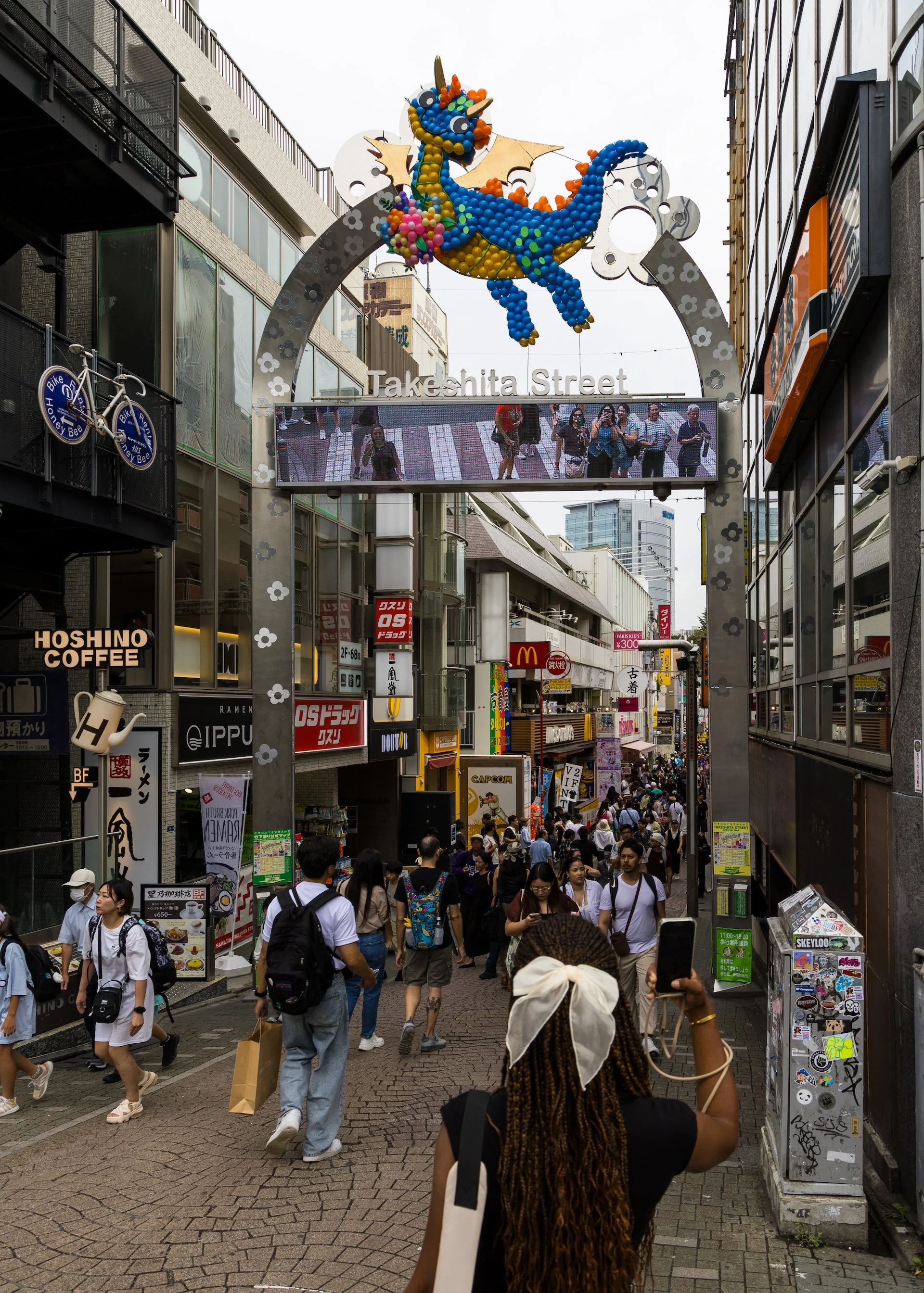  Takeshita Street - another example of creating social media moments - you can take pictures of yourself on the screen on the street sign - and everyone was. 