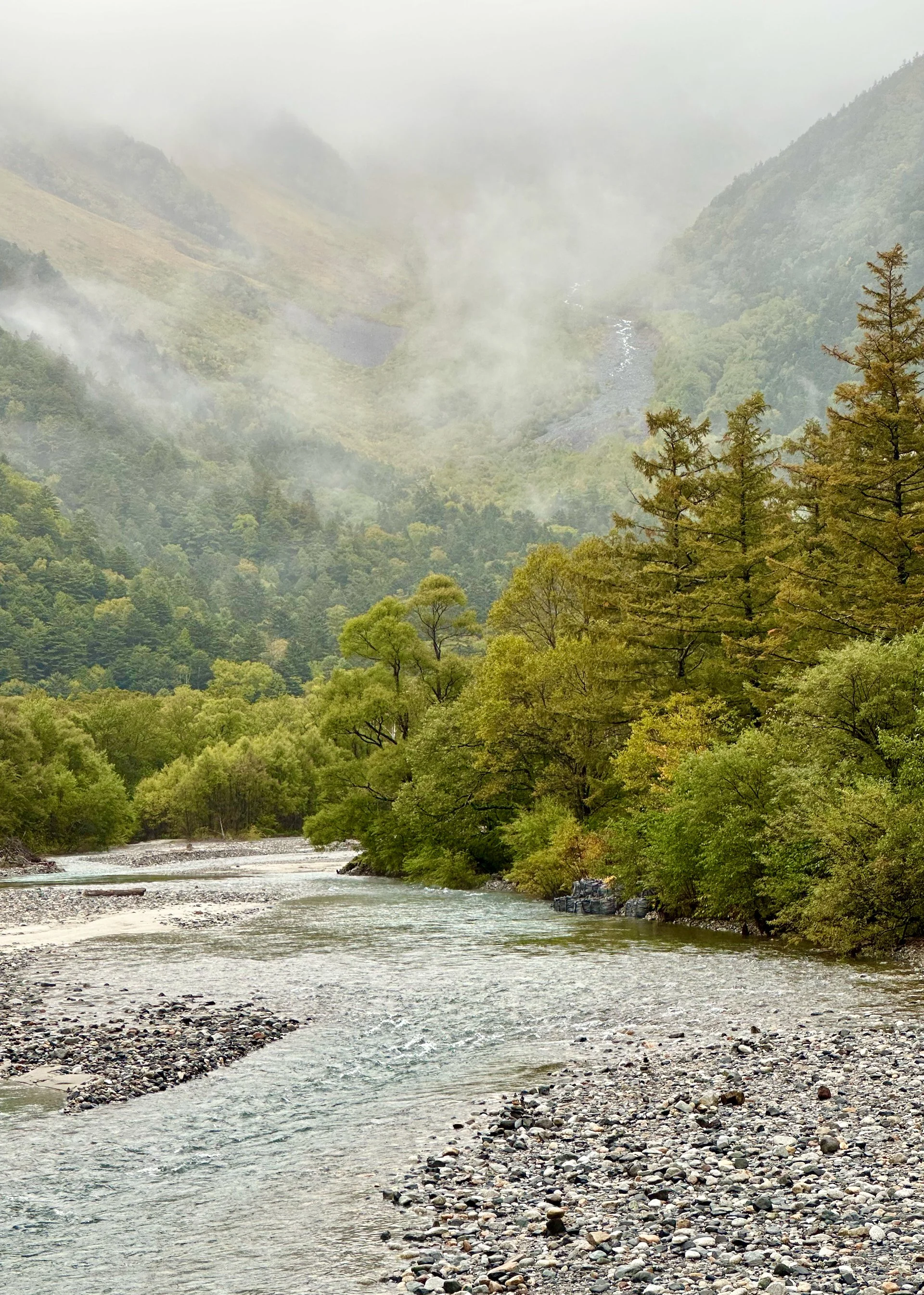  The rain let up and the clouds started to lift. We could start to see the mountains that surround the valley and the town.  