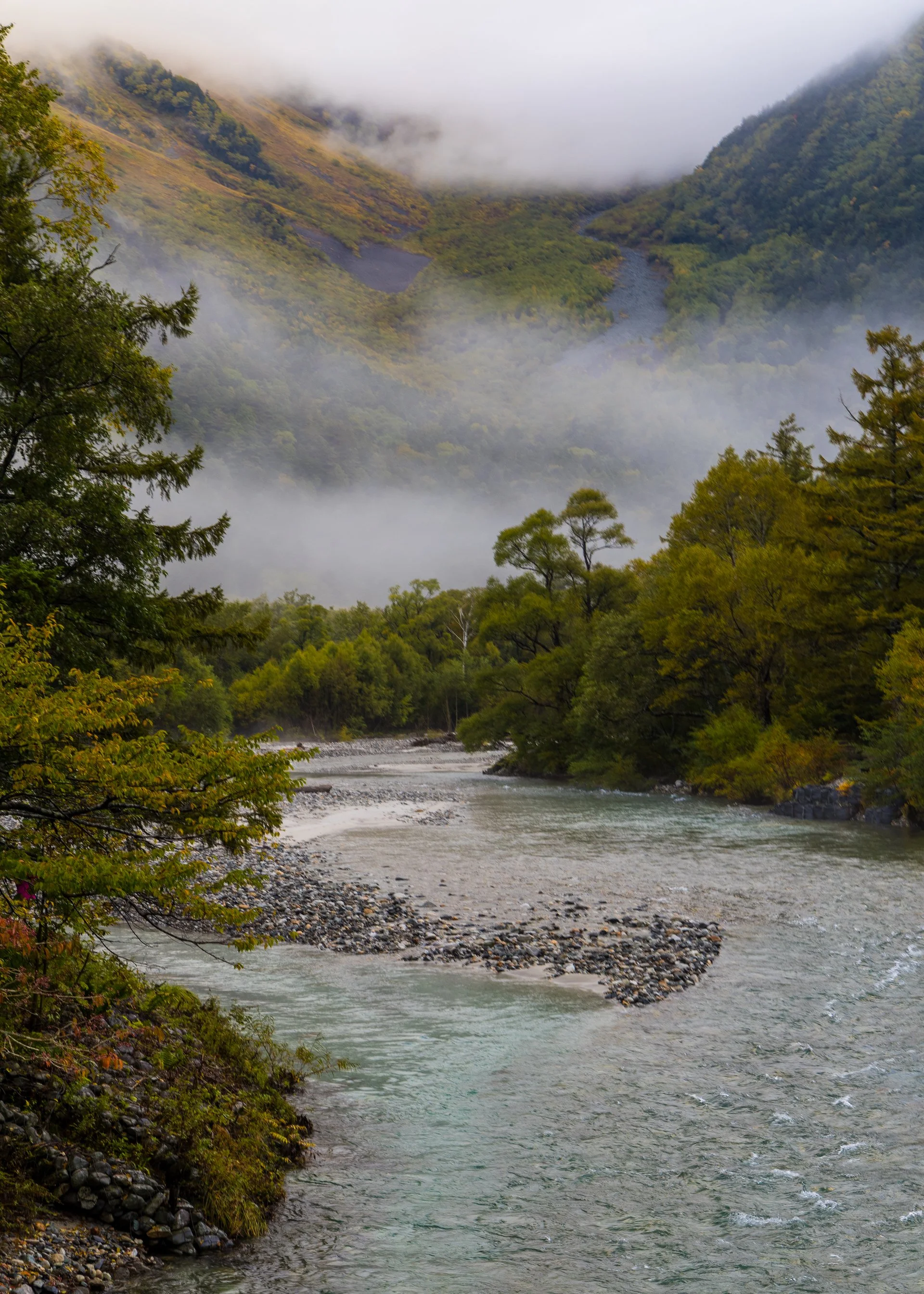  The clouds lifting, exposing the fall colours.  