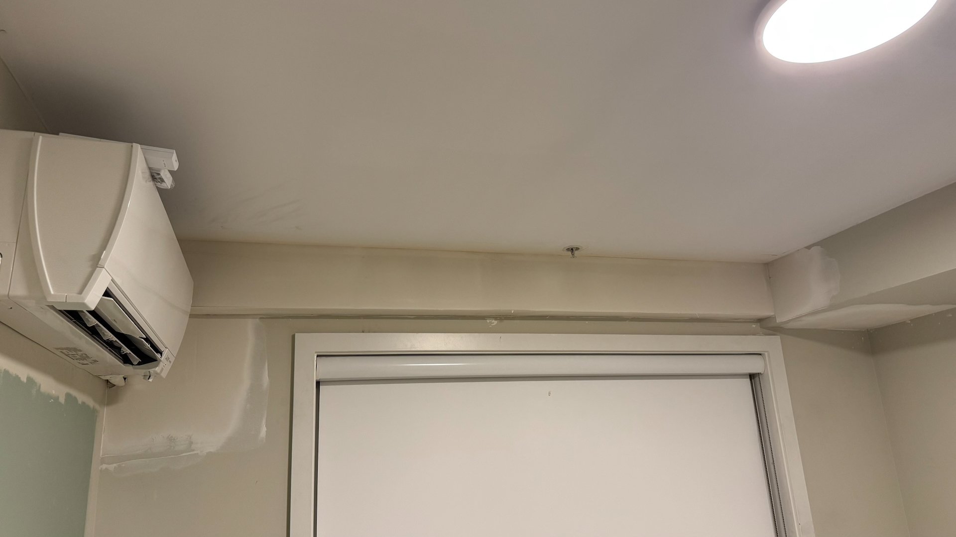  Here you can see the new head unit in the spare bedroom. Similarly to the kitchen they ran along the top of the wall, and so we had to build out a drywall box over it all.   