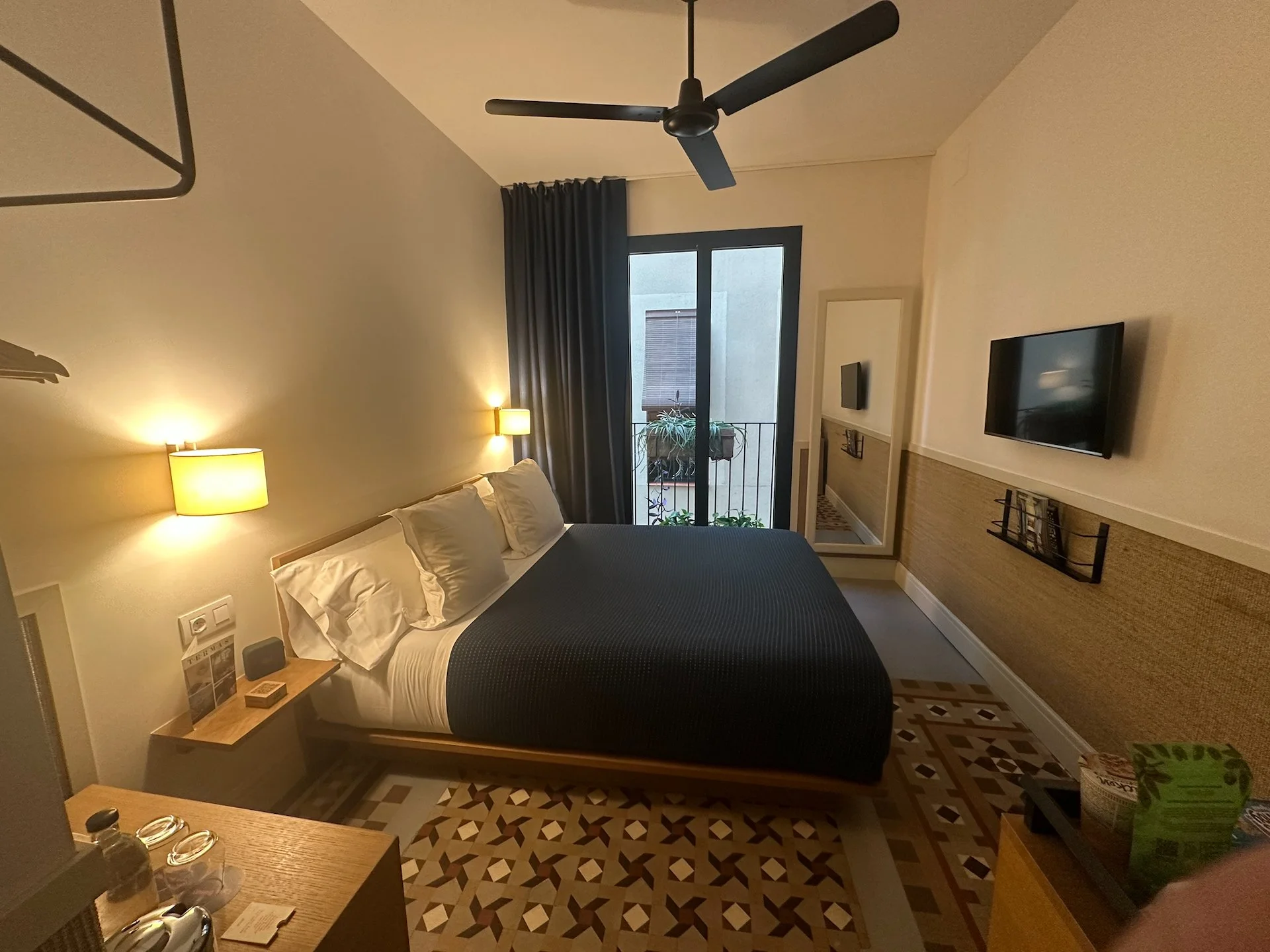  The room was nice enough, if a bit small, and the lack of a desk was not ideal. 