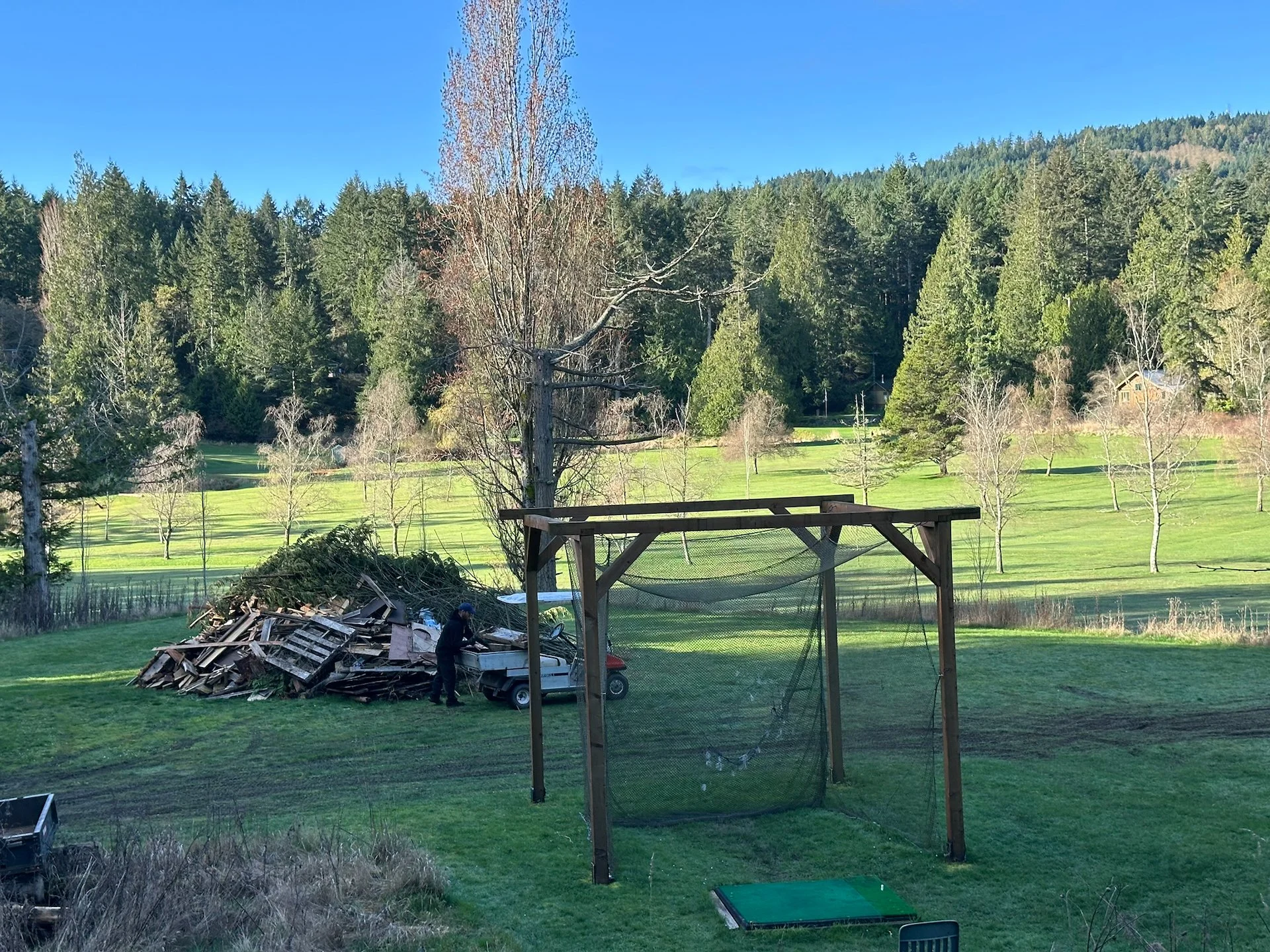  Over the course of the winter we’ve been building up this burn pile to collect all the downed branches, dead trees and other material that has been cleaned up off the golf course. We made it a fair bit bigger over the course of the day. 