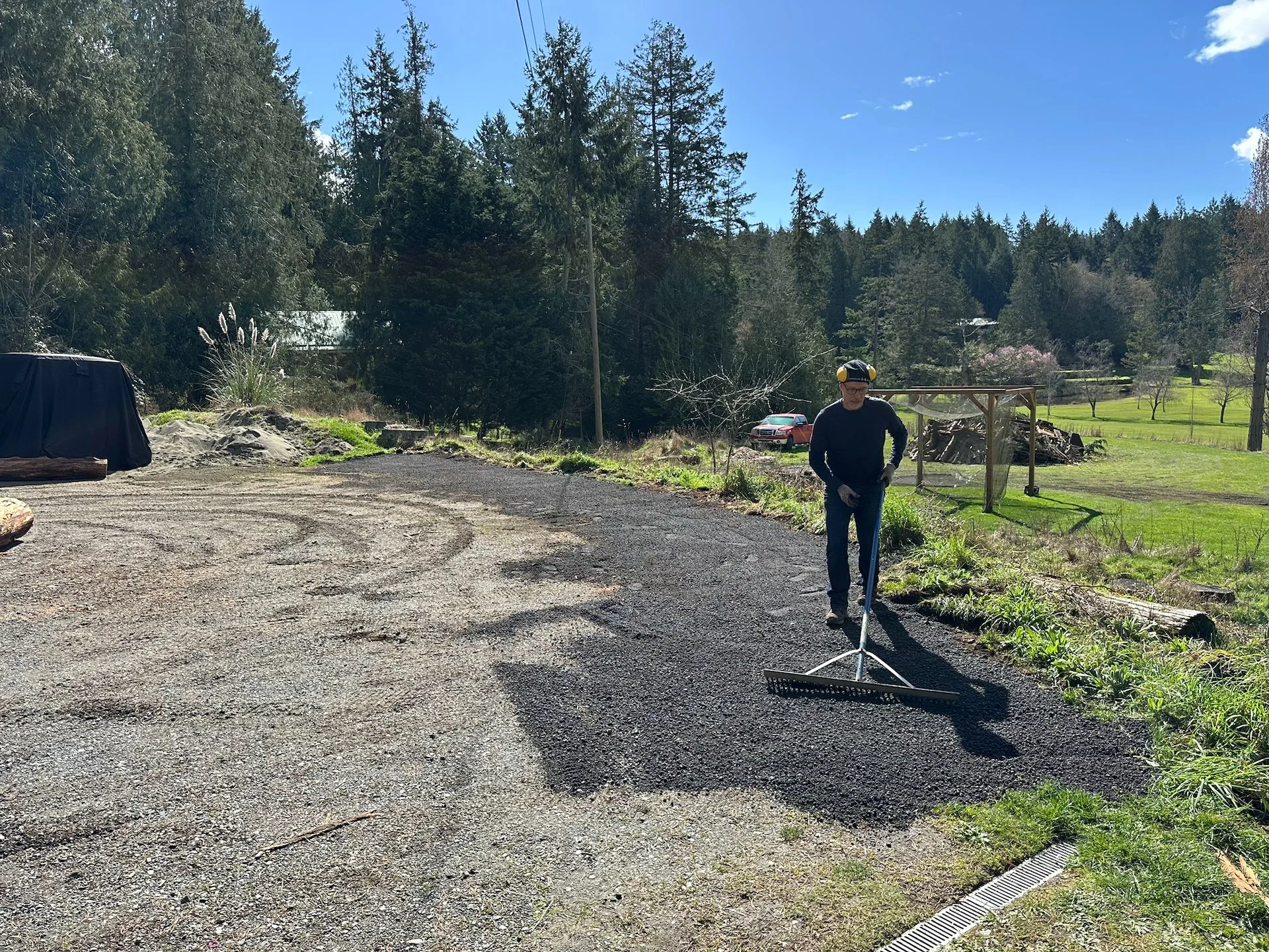  Spreading out the asphalt grindings to make a much cleaner, safer front of the parking lot.  