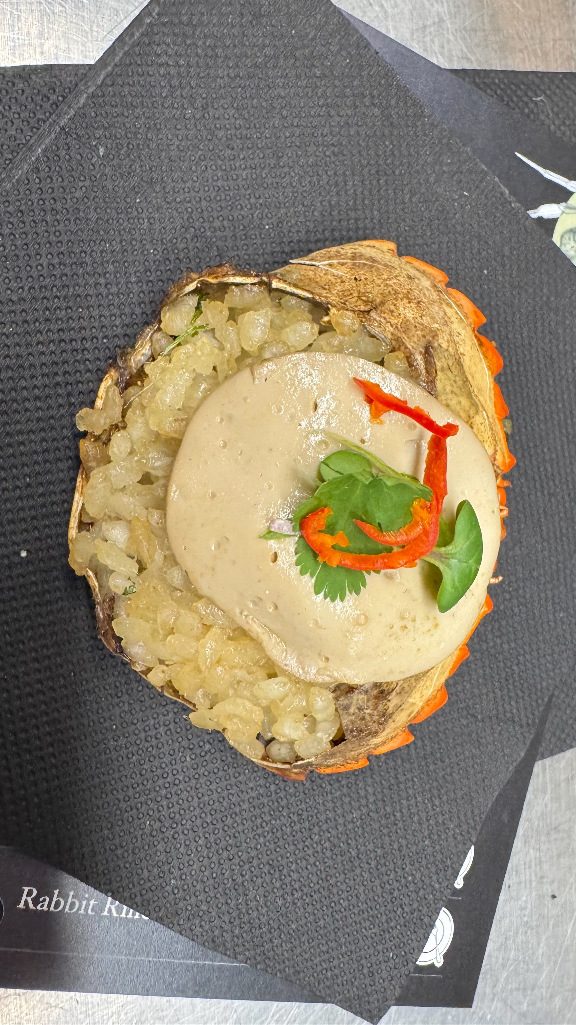  Our first appetiser. Rice and green crab (an invasive species) in a green crab sauce, served in the crab shells. 