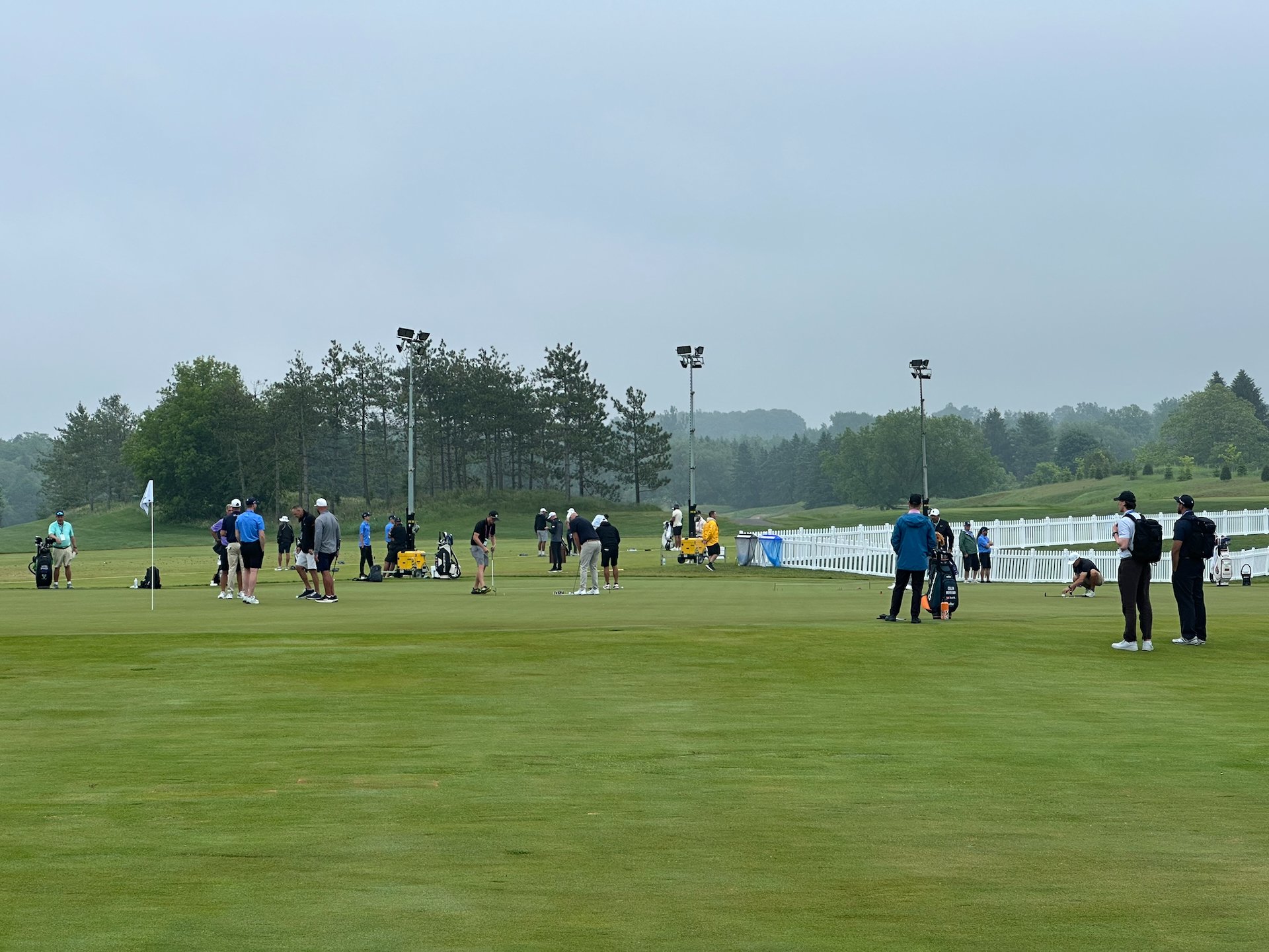  Watching some groups at the practice area before teeing off. 