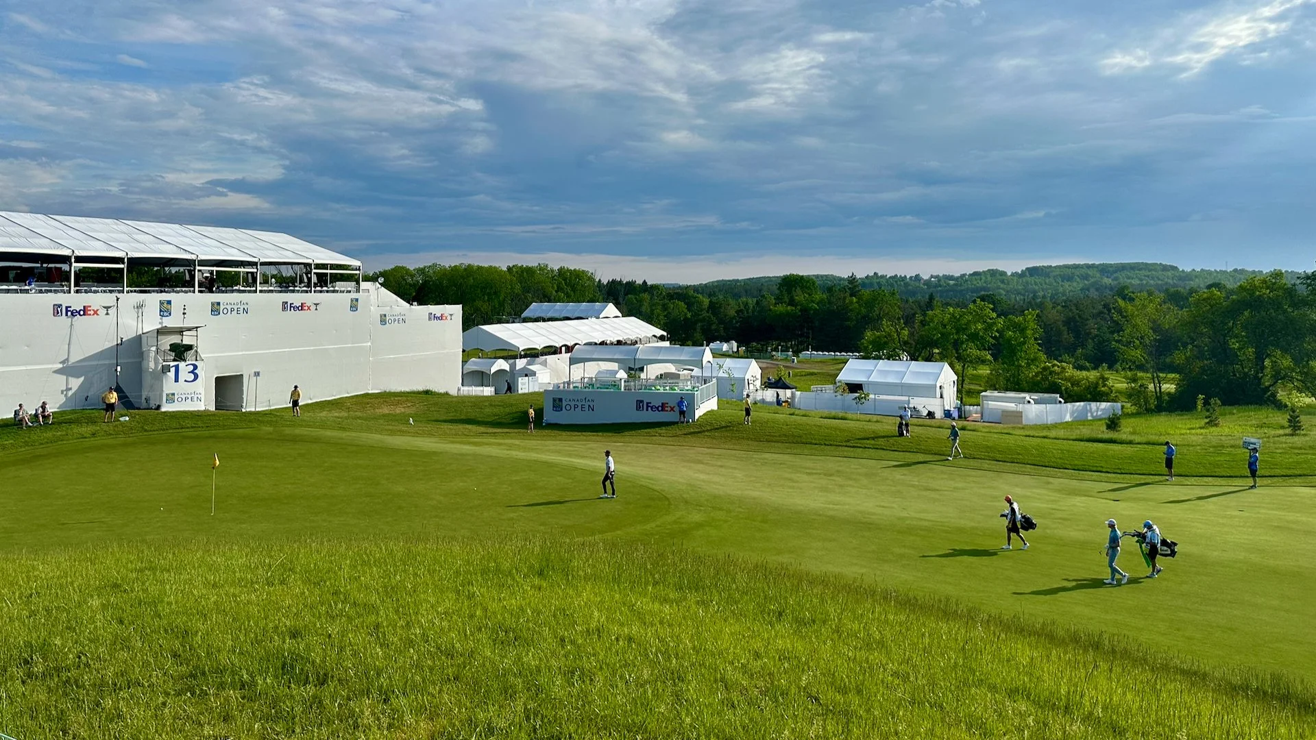  One of the interesting spots I found to watch from was this little knoll near the 13th green. You could see the guys hitting into it from the fairway  and see them putting on the green. And it was close enough that you could scott back and forth bet
